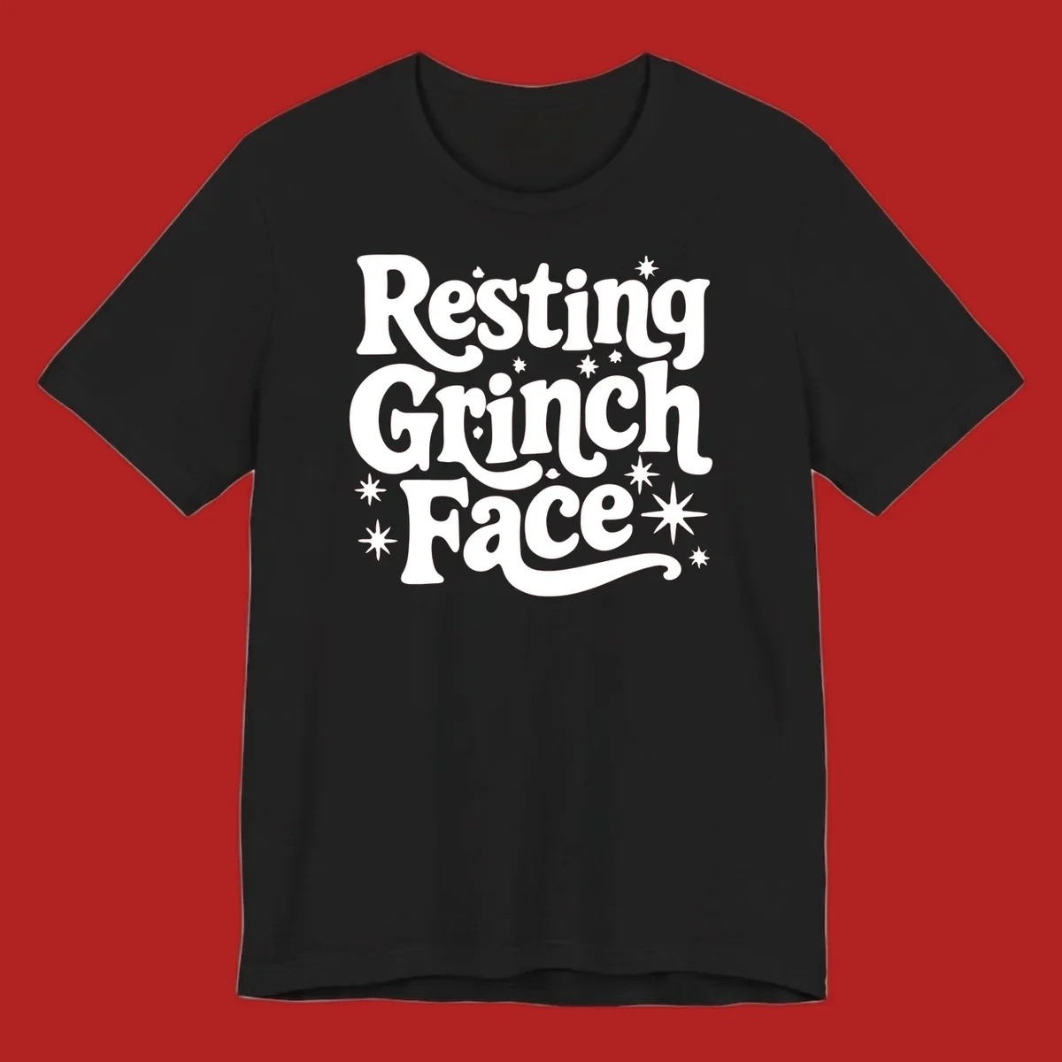 Resting Grinch Face text with stars, holiday design.