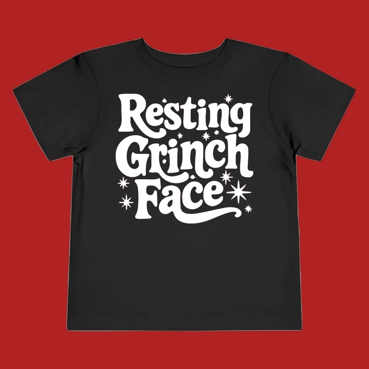 Resting Grinch Face text with stars, holiday design.