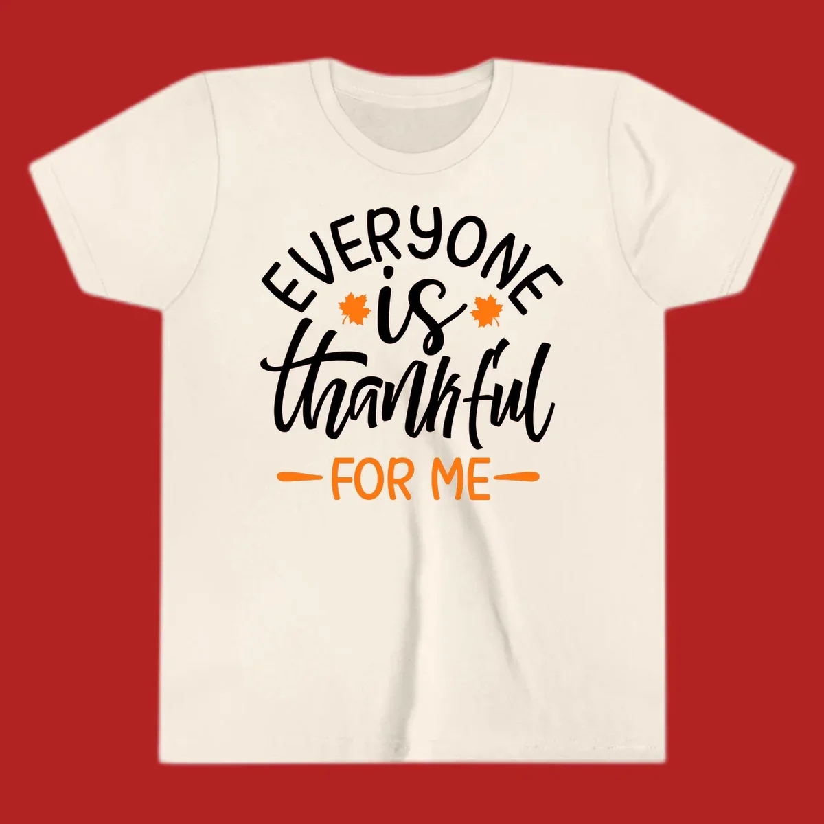 Typography design with text "EVERYONE is thankful FOR ME" and maple leaves, for Thanksgiving.