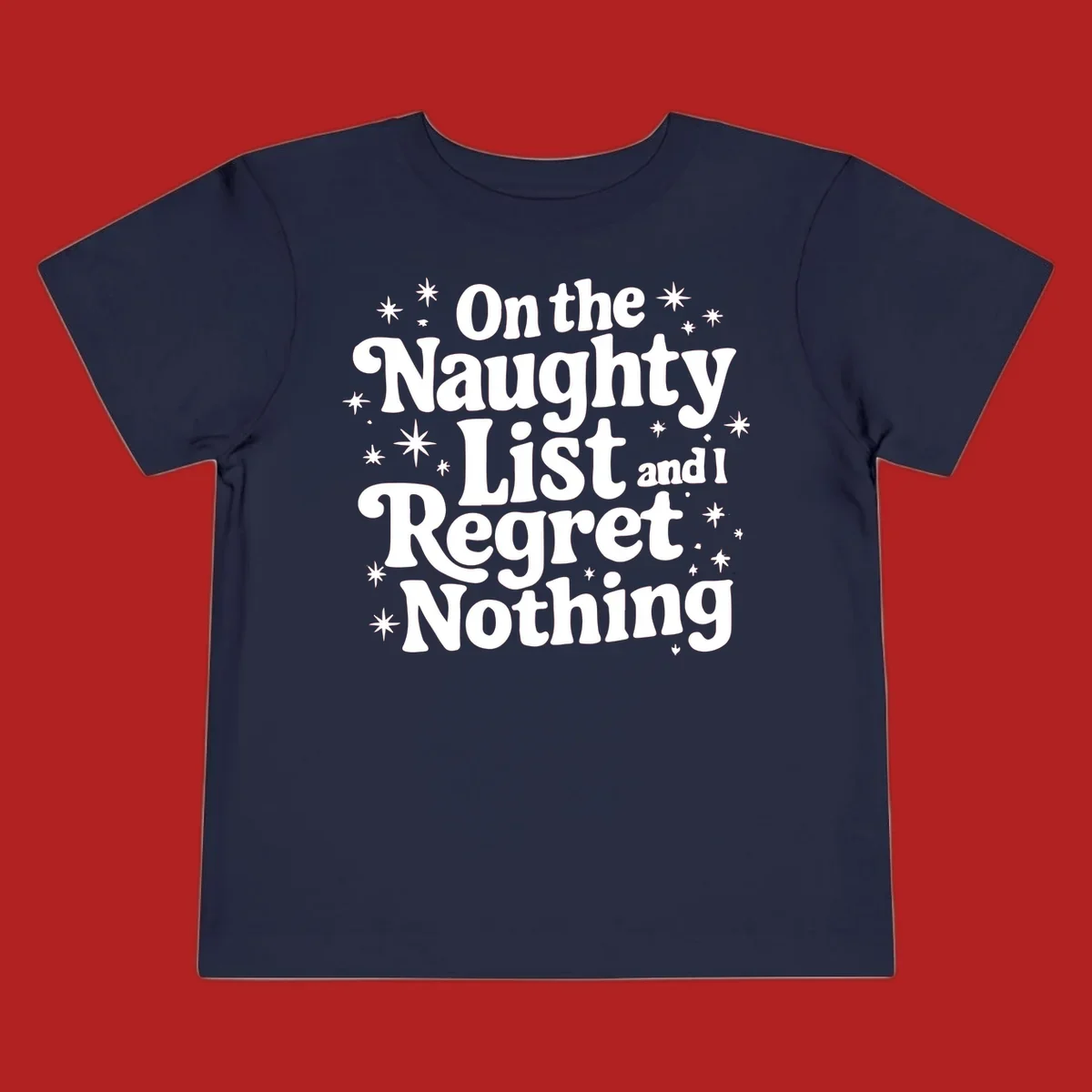 On the Naughty List And I Regret Nothing white text with stars graphic.