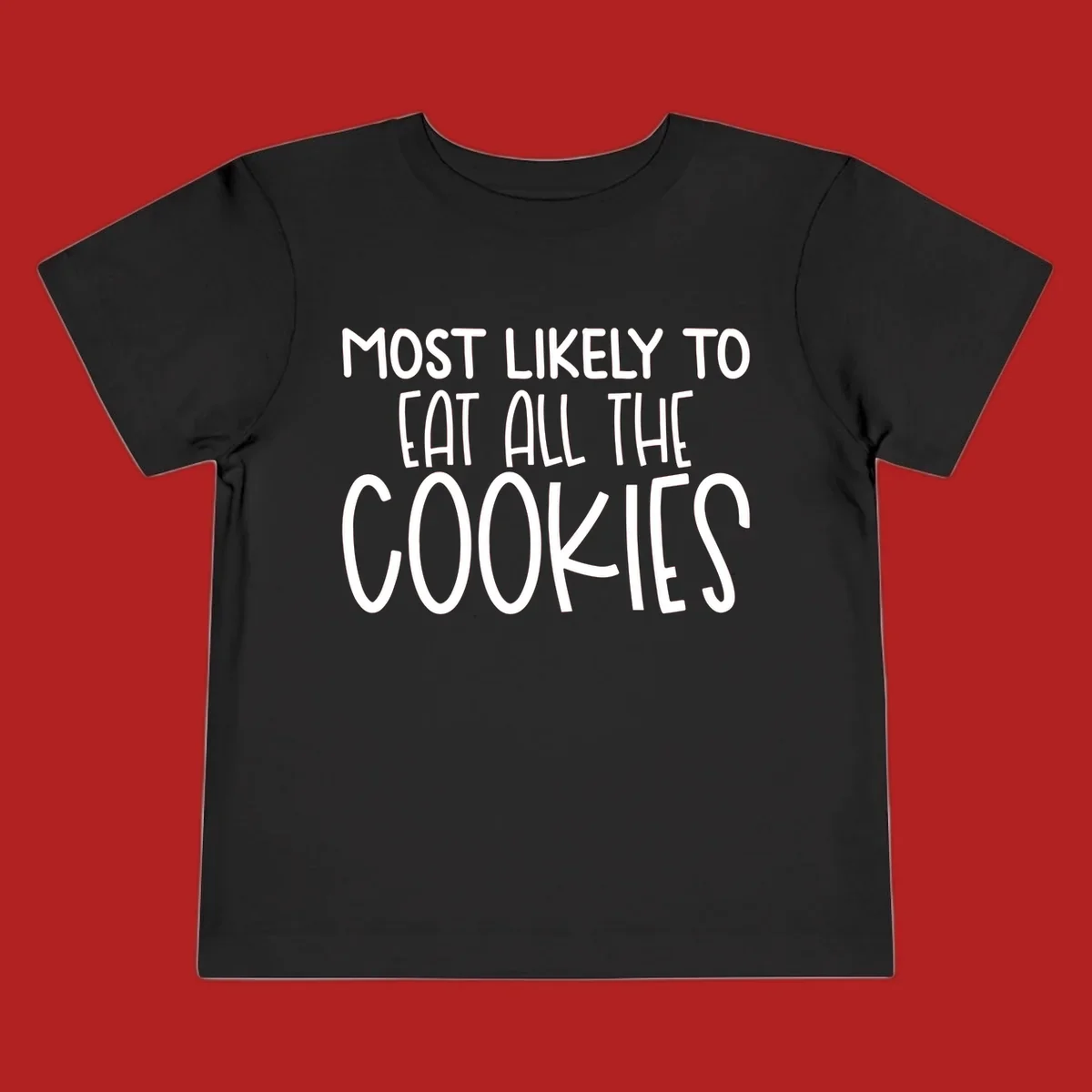 White text 'Most Likely To Eat All The Cookies' on a black background. typography