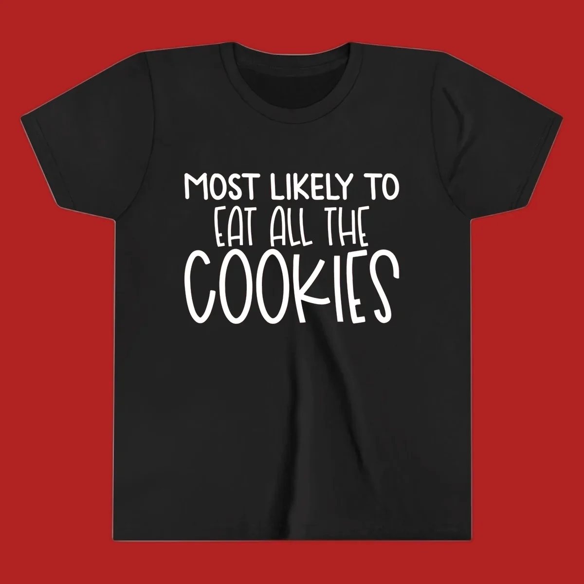 White text 'Most Likely To Eat All The Cookies' on a black background. typography