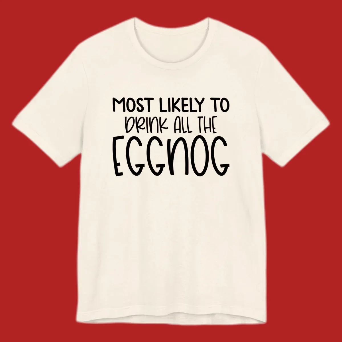 Text design 'Most Likely To Drink All The Eggnog' in white festive lettering for Christmas.