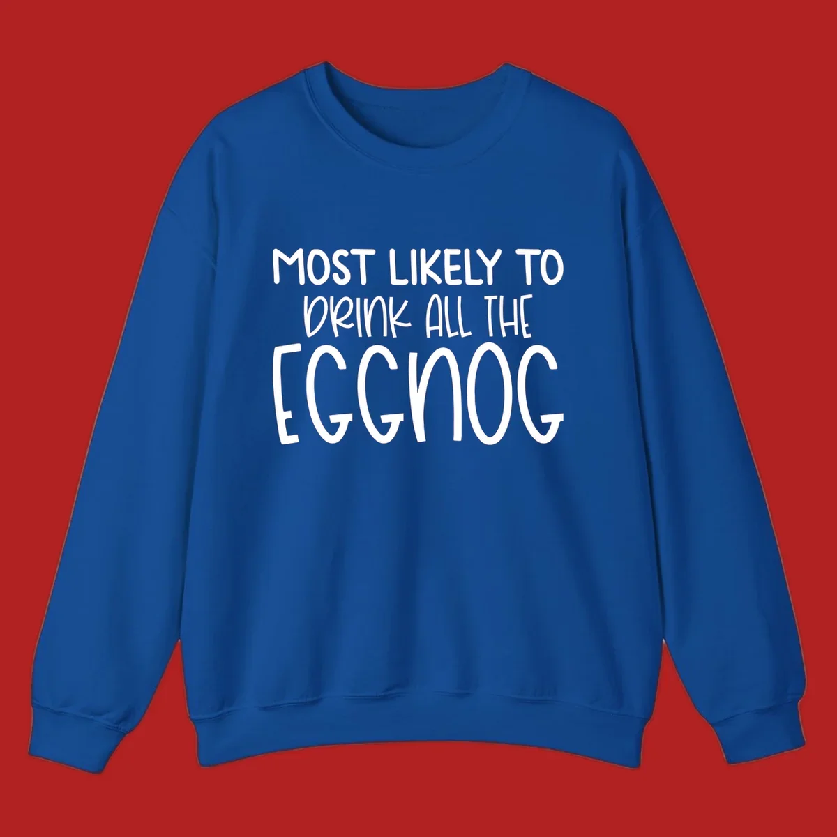 Text design 'Most Likely To Drink All The Eggnog' in white festive lettering for Christmas.