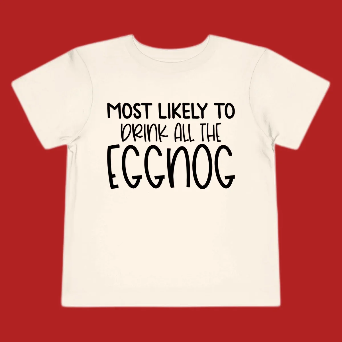 Text design 'Most Likely To Drink All The Eggnog' in white festive lettering for Christmas.