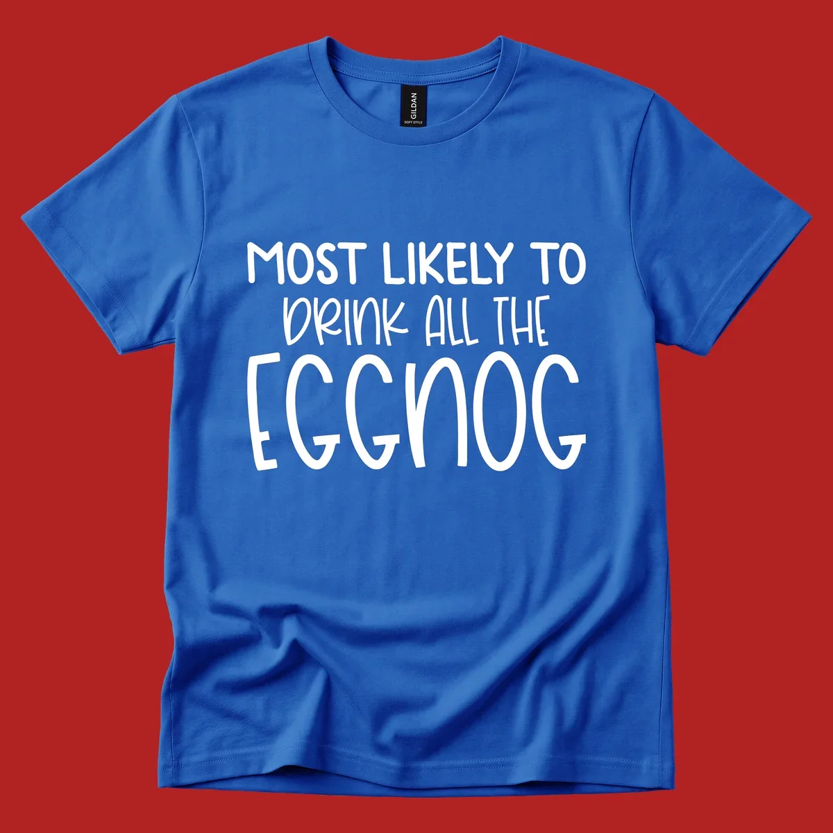 Text design 'Most Likely To Drink All The Eggnog' in white festive lettering for Christmas.
