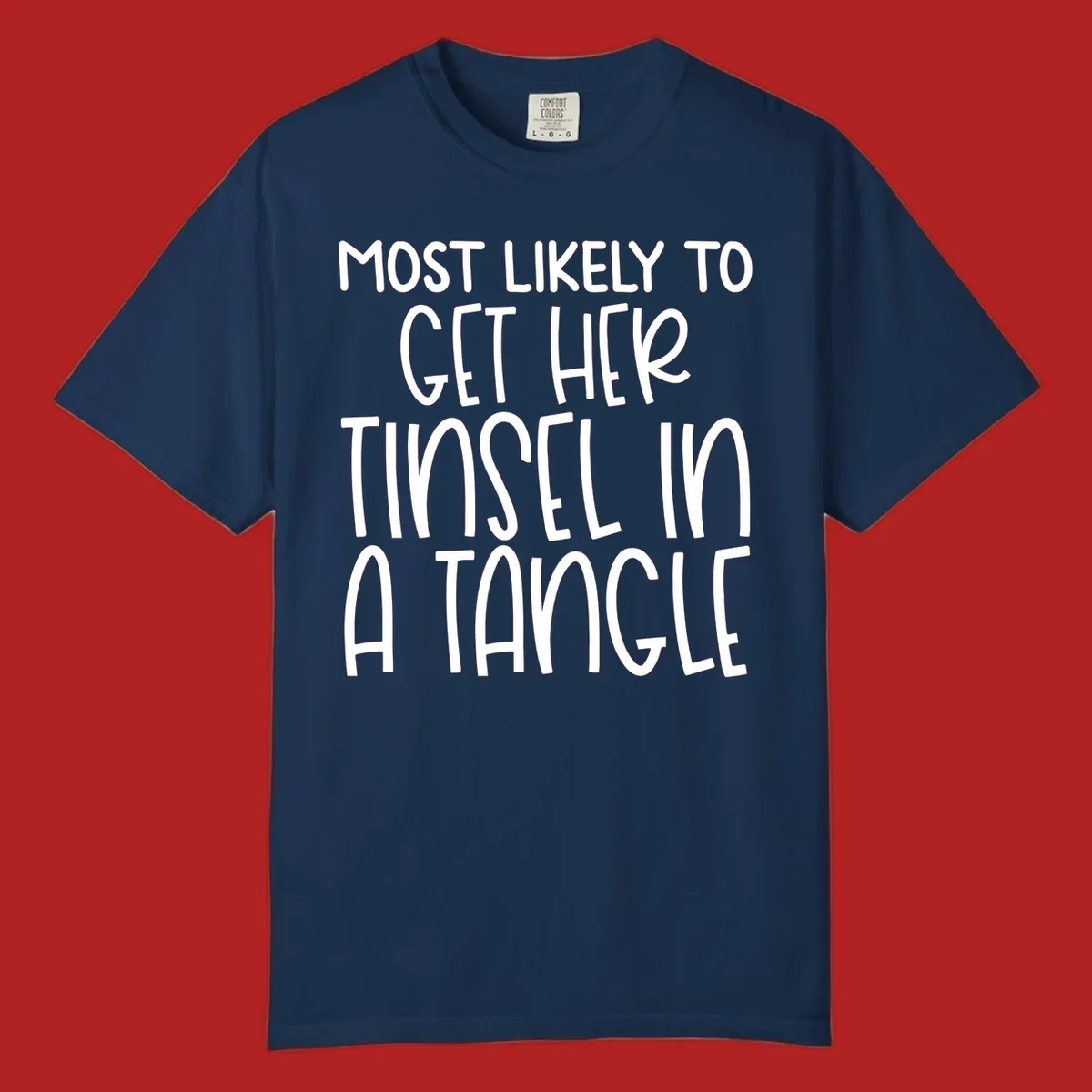 White text 'Most Likely To Get Her Tinsel In A Tangle' on a black background, holiday phrase.
