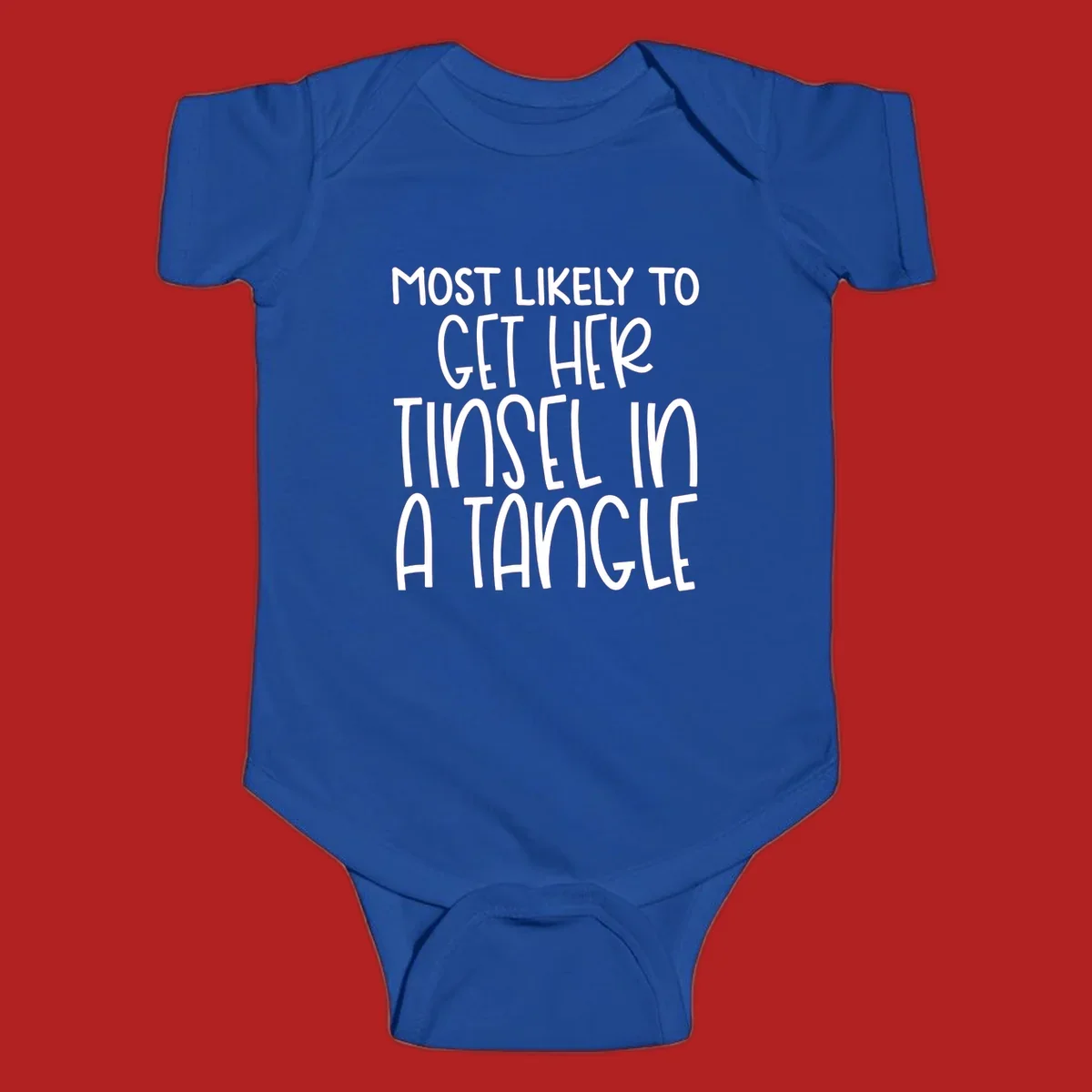White text 'Most Likely To Get Her Tinsel In A Tangle' on a black background, holiday phrase.