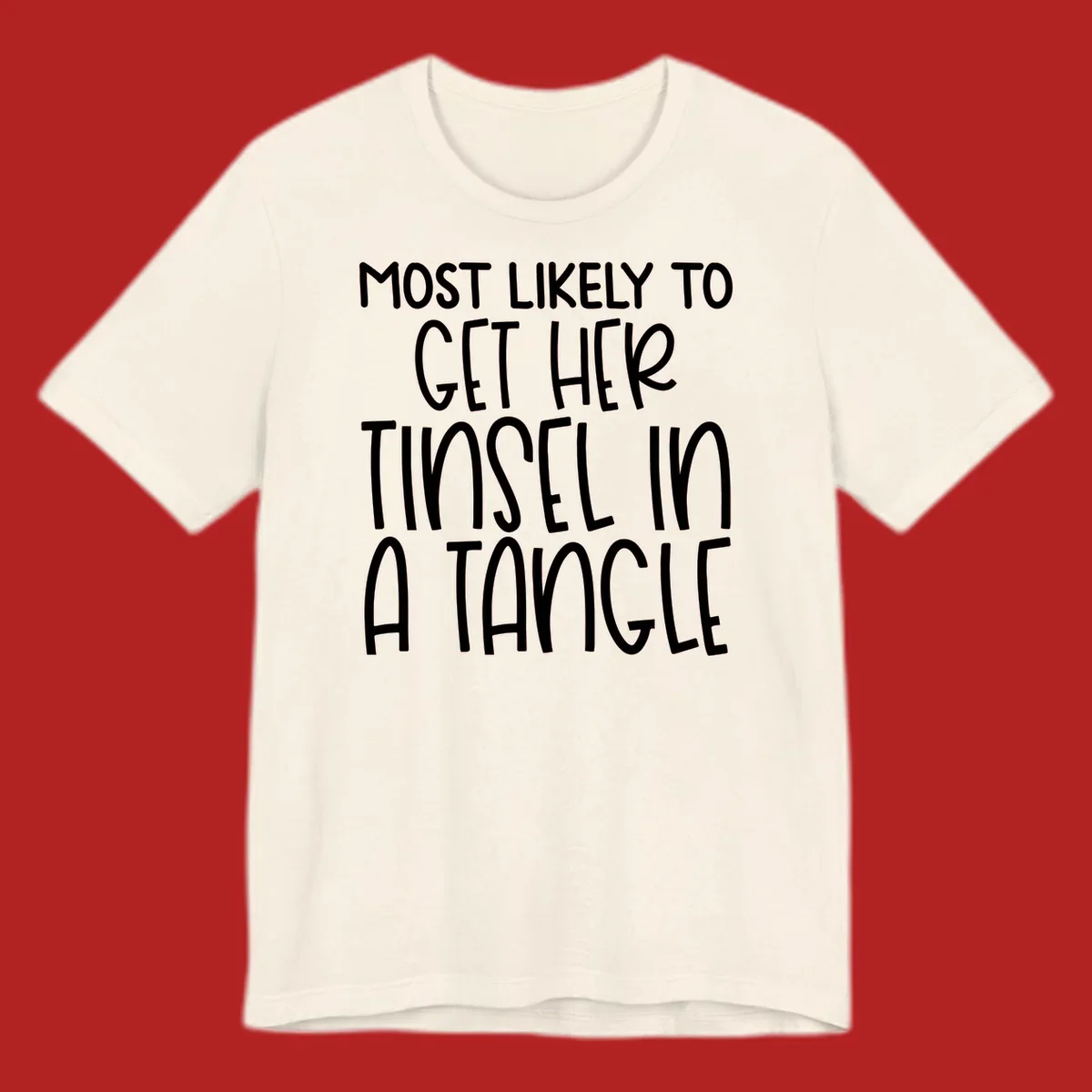 White text 'Most Likely To Get Her Tinsel In A Tangle' on a black background, holiday phrase.