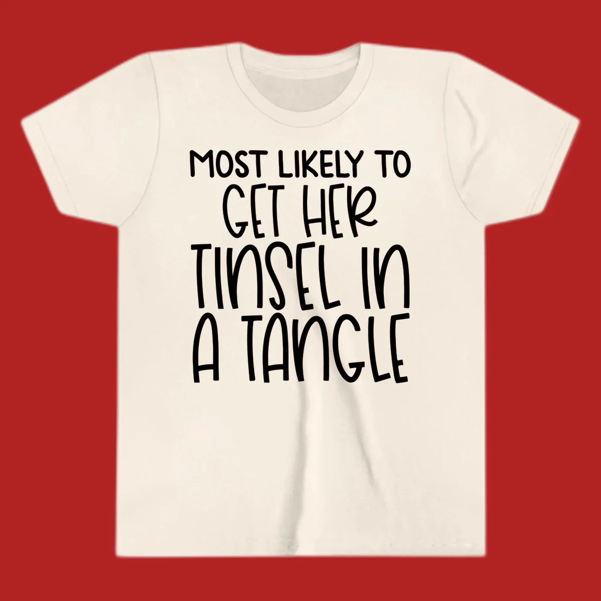 White text 'Most Likely To Get Her Tinsel In A Tangle' on a black background, holiday phrase.