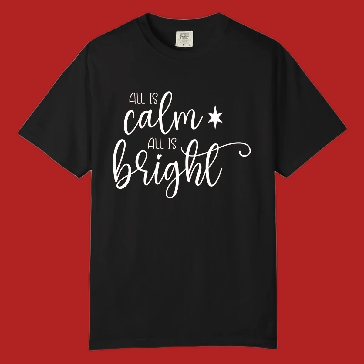 Elegant white script text 'All Is Calm All Is Bright' with star and heart, holiday design.