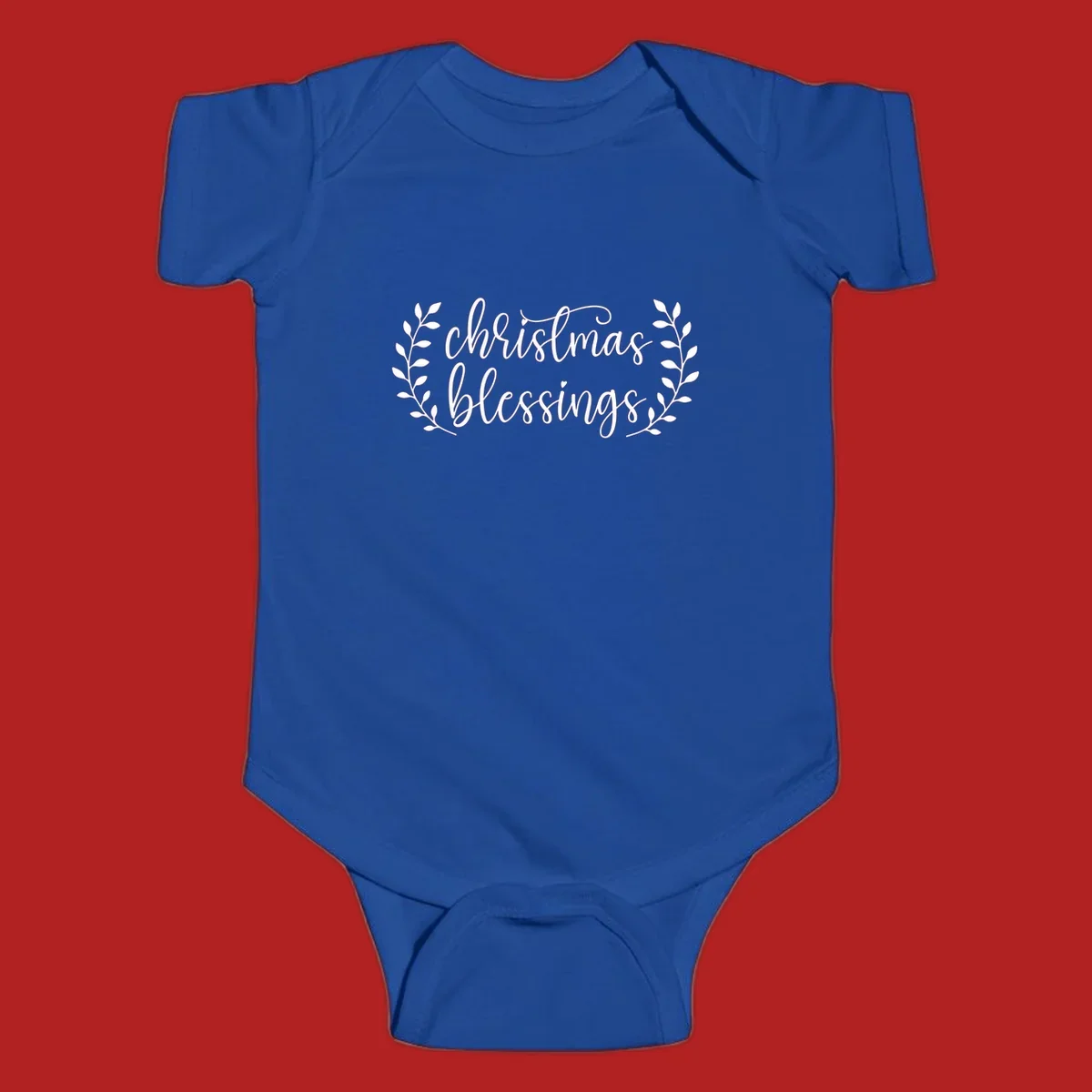 Christmas blessings text with leafy branches accent.