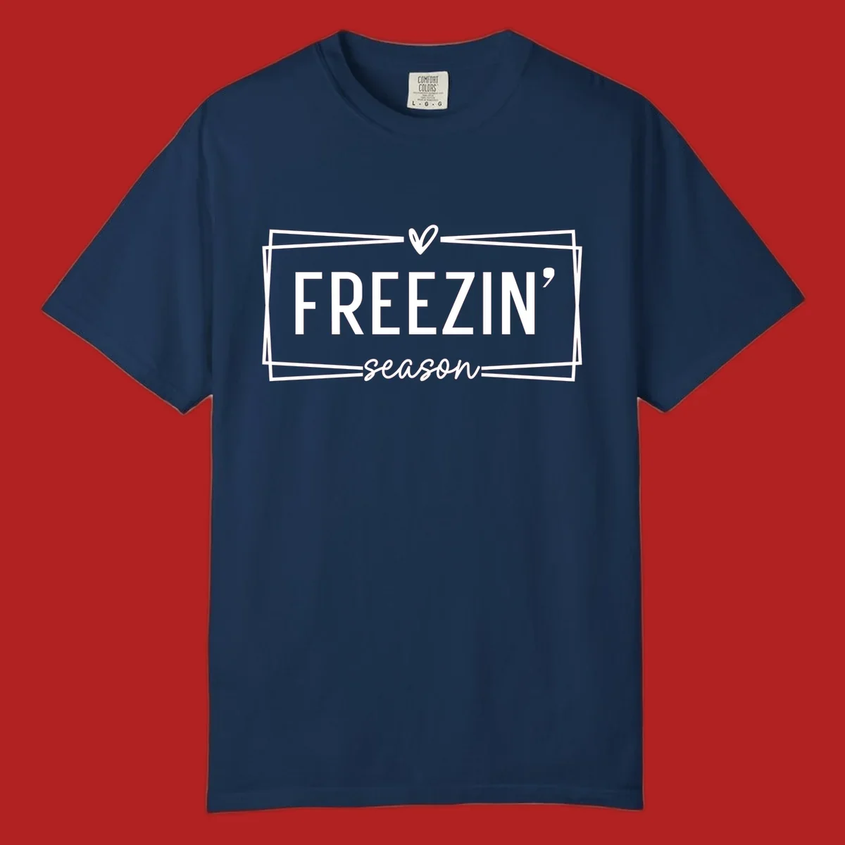 Freezin' Season text design with heart icon and border, for winter holidays.
