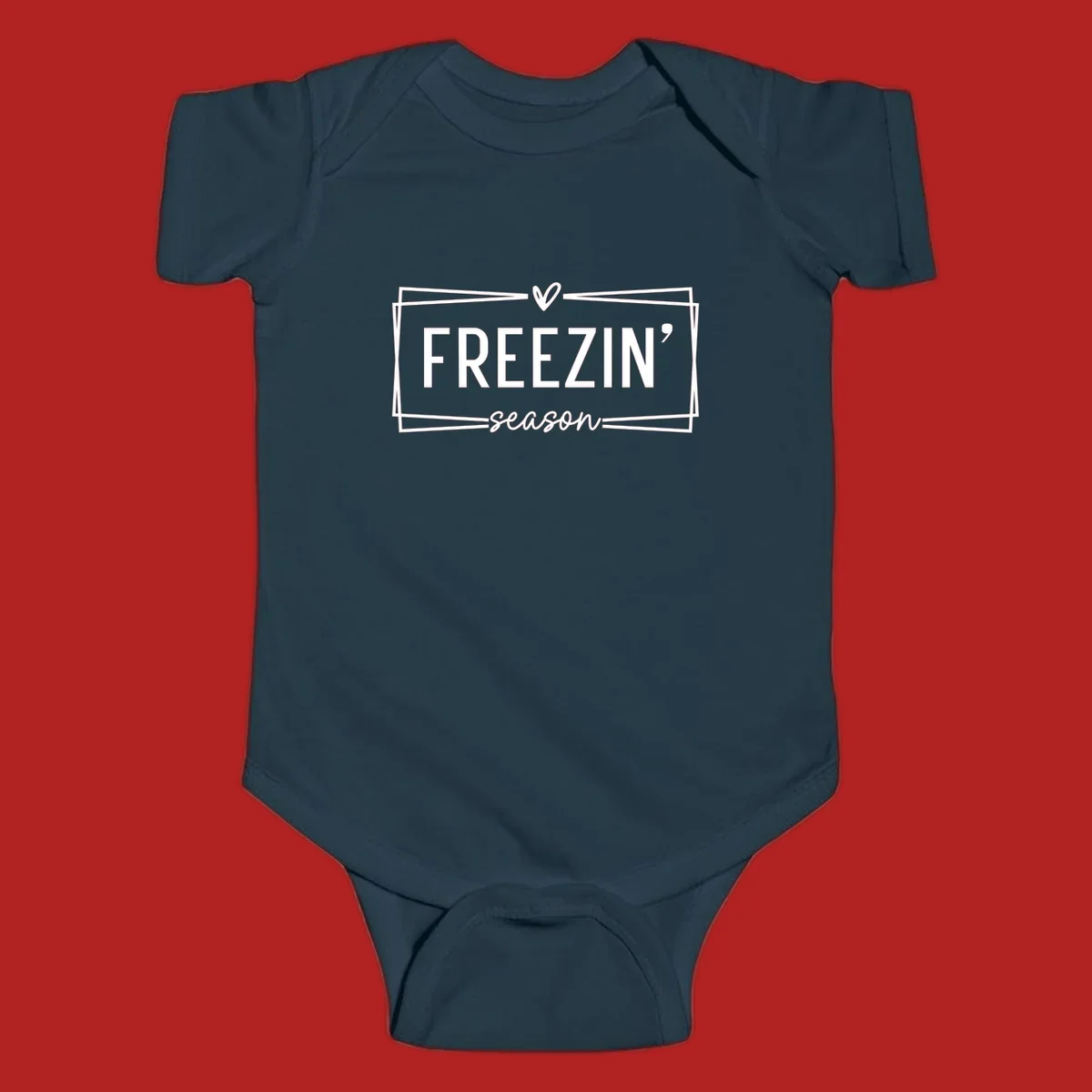 Freezin' Season text design with heart icon and border, for winter holidays.