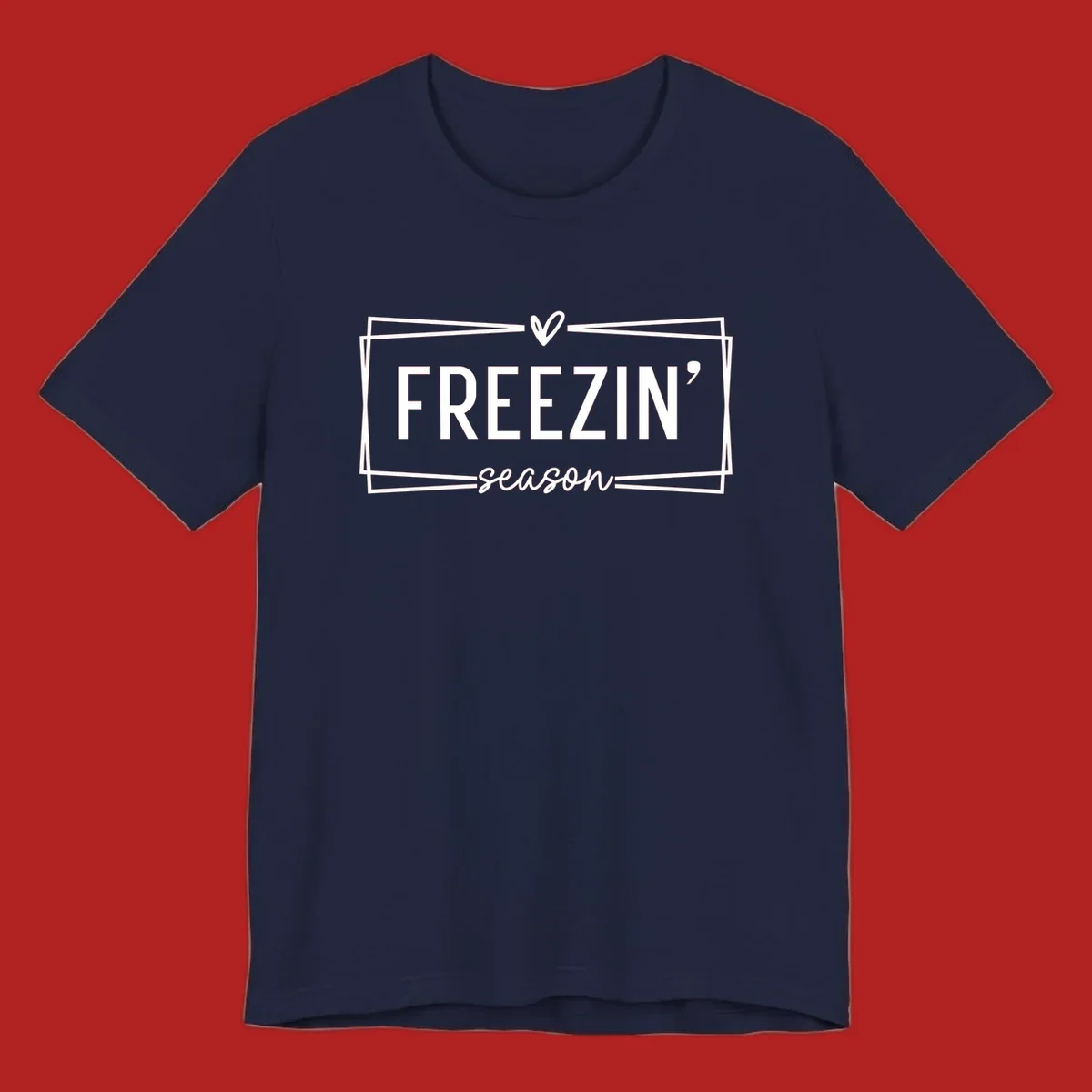 Freezin' Season text design with heart icon and border, for winter holidays.