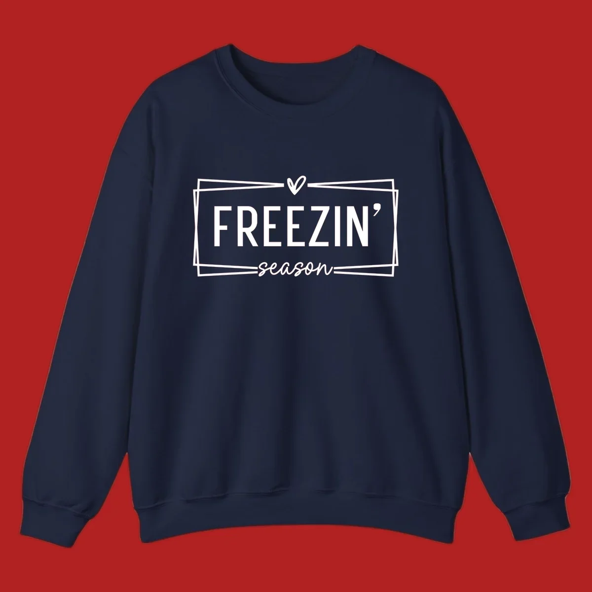 Freezin' Season text design with heart icon and border, for winter holidays.