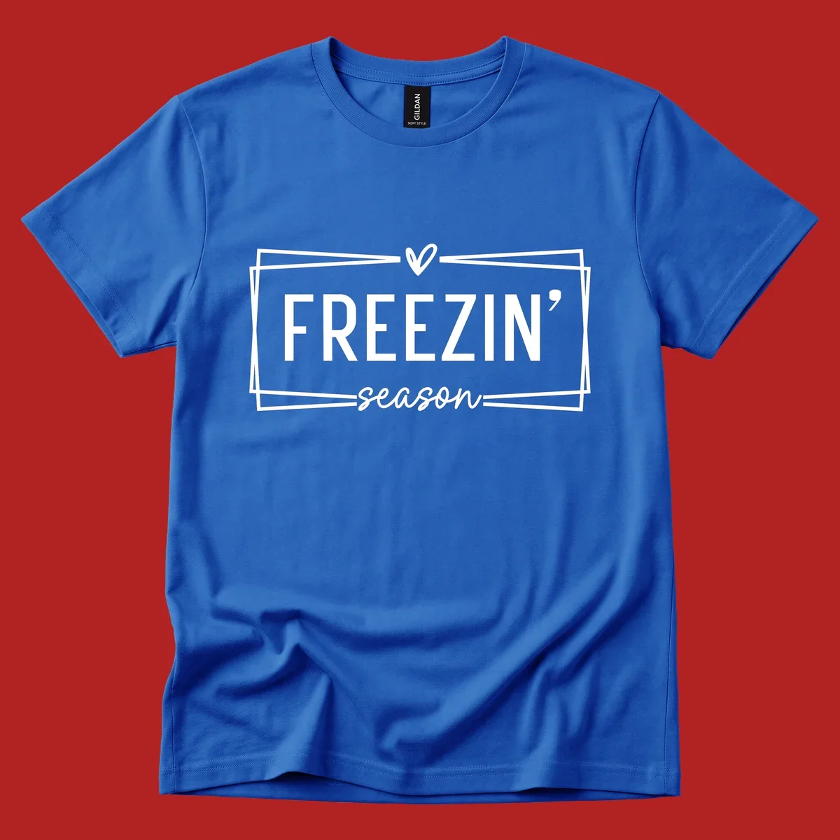 Freezin' Season text design with heart icon and border, for winter holidays.