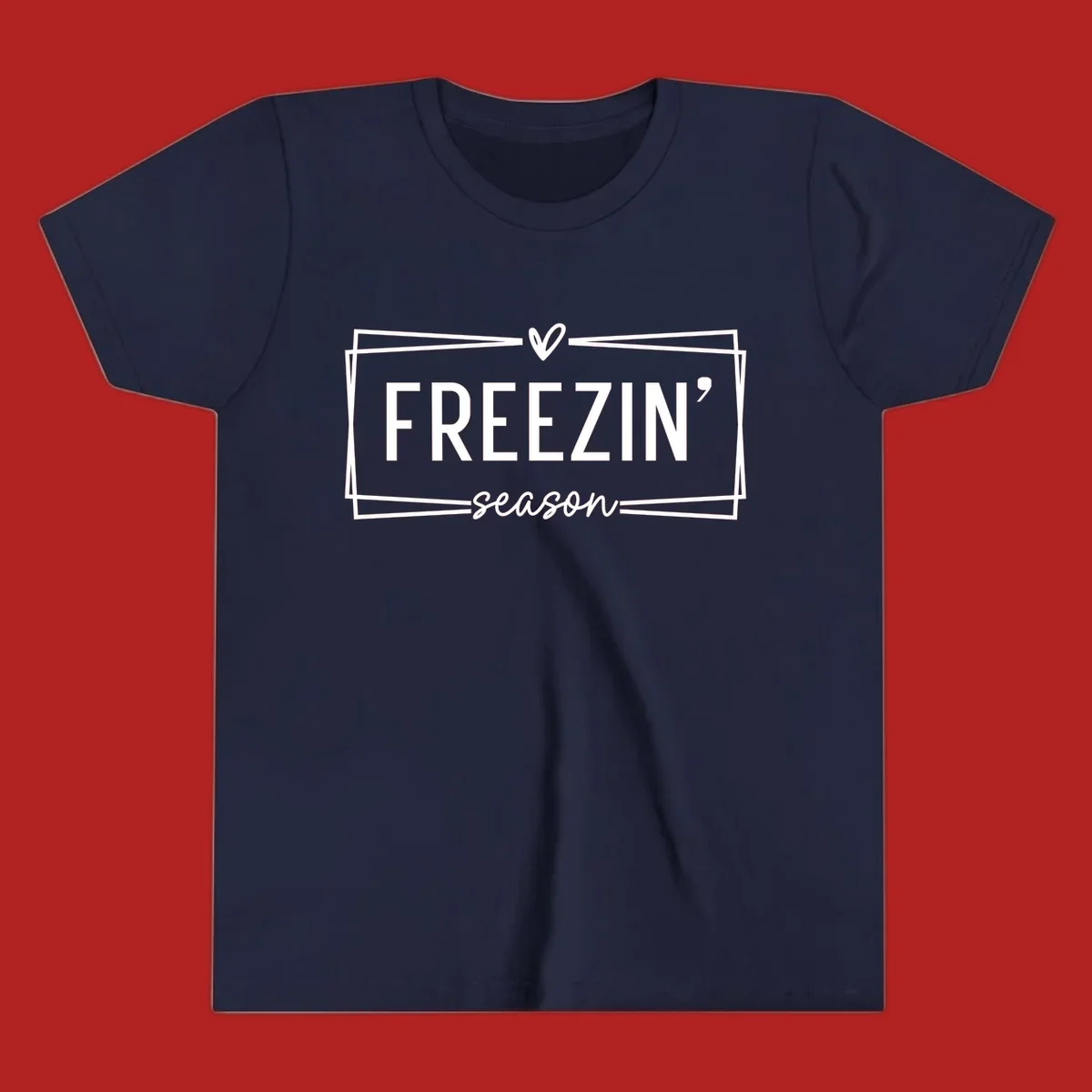 Freezin' Season text design with heart icon and border, for winter holidays.
