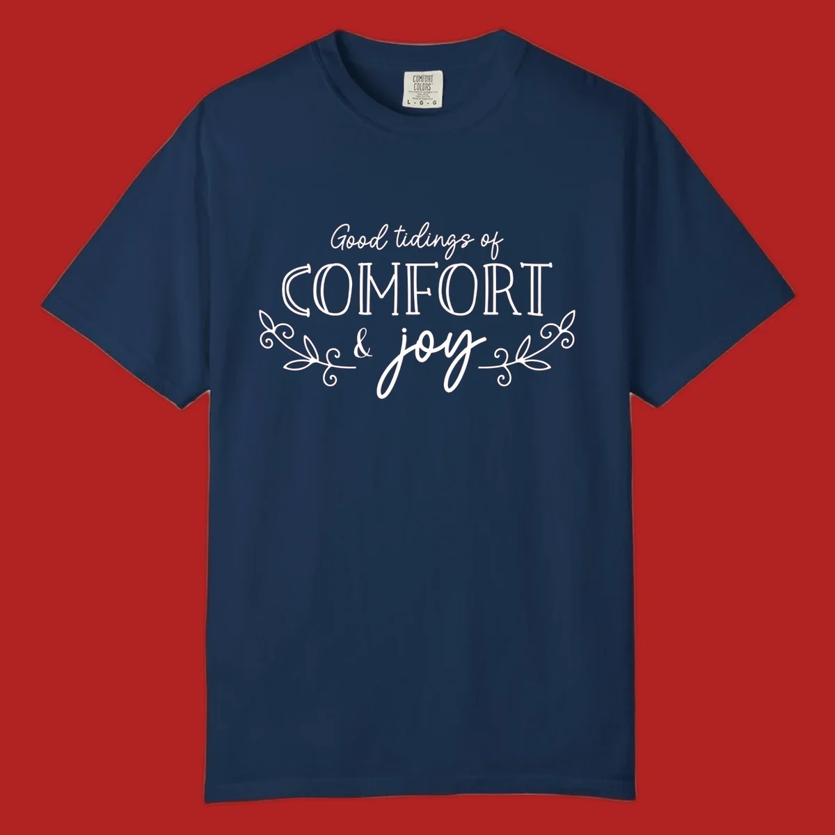 Good tidings of comfort and joy holiday text design with floral accents.