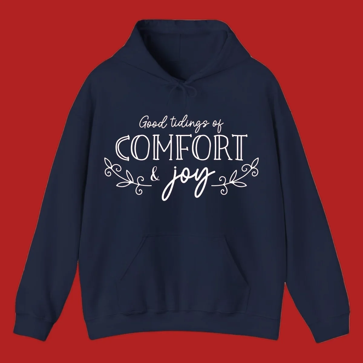 Good tidings of comfort and joy holiday text design with floral accents.