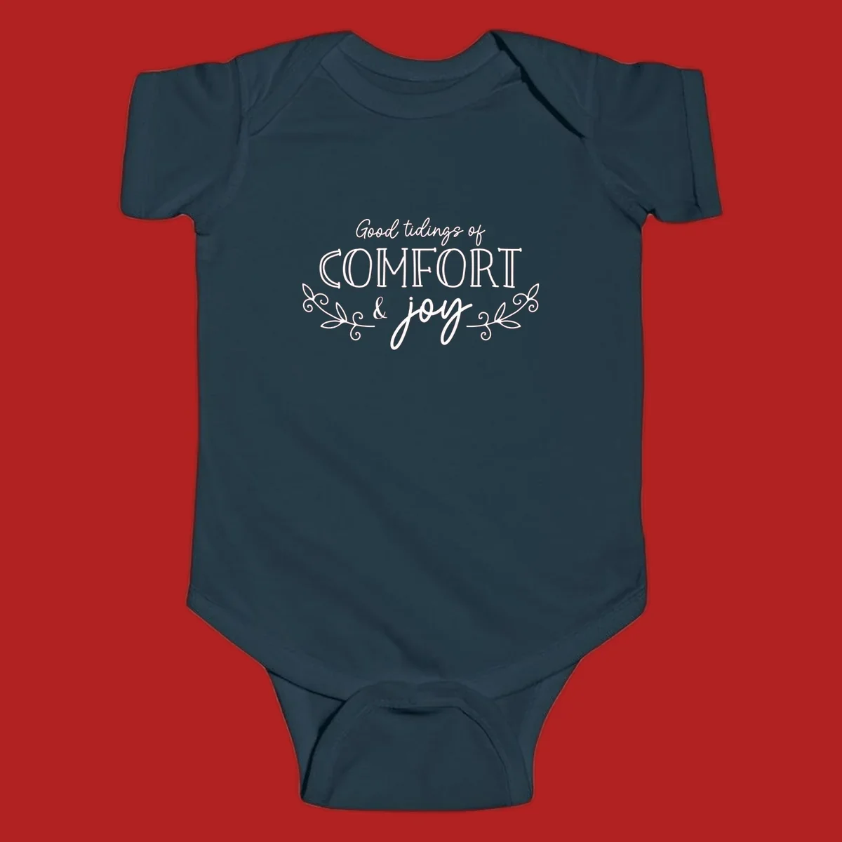 Good tidings of comfort and joy holiday text design with floral accents.