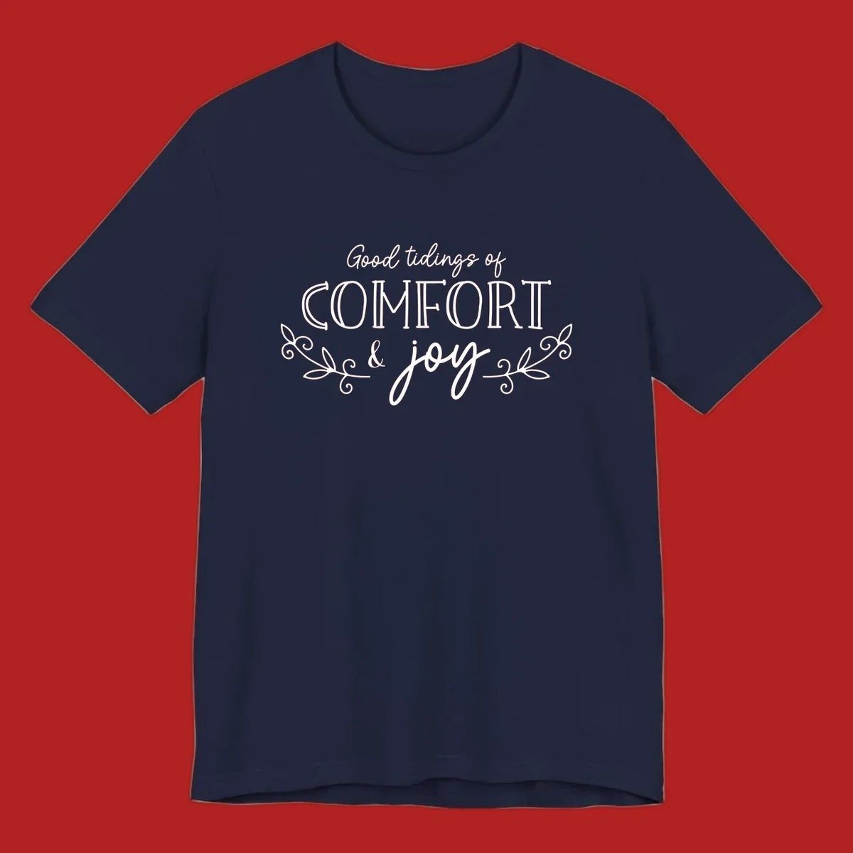 Good tidings of comfort and joy holiday text design with floral accents.