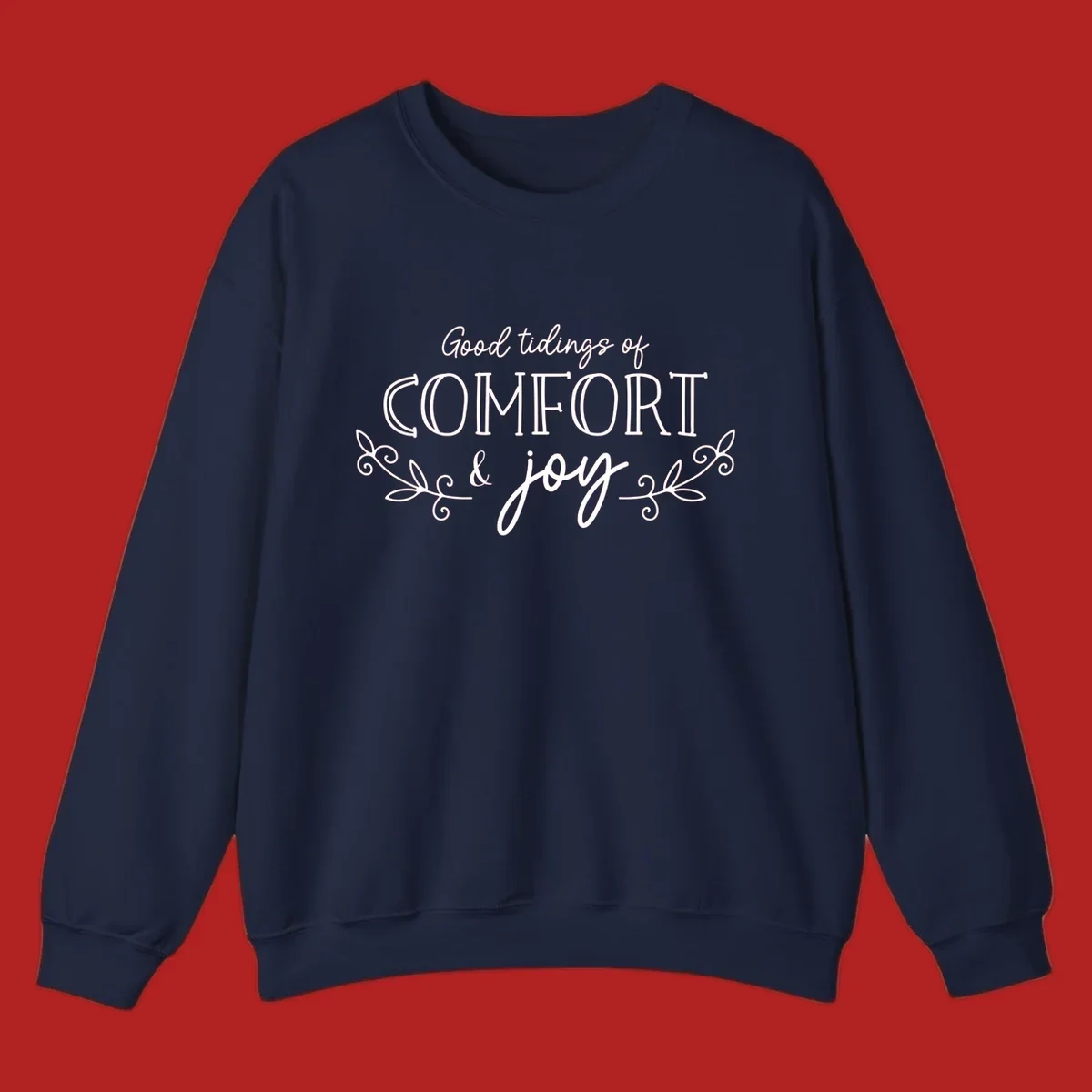 Good tidings of comfort and joy holiday text design with floral accents.