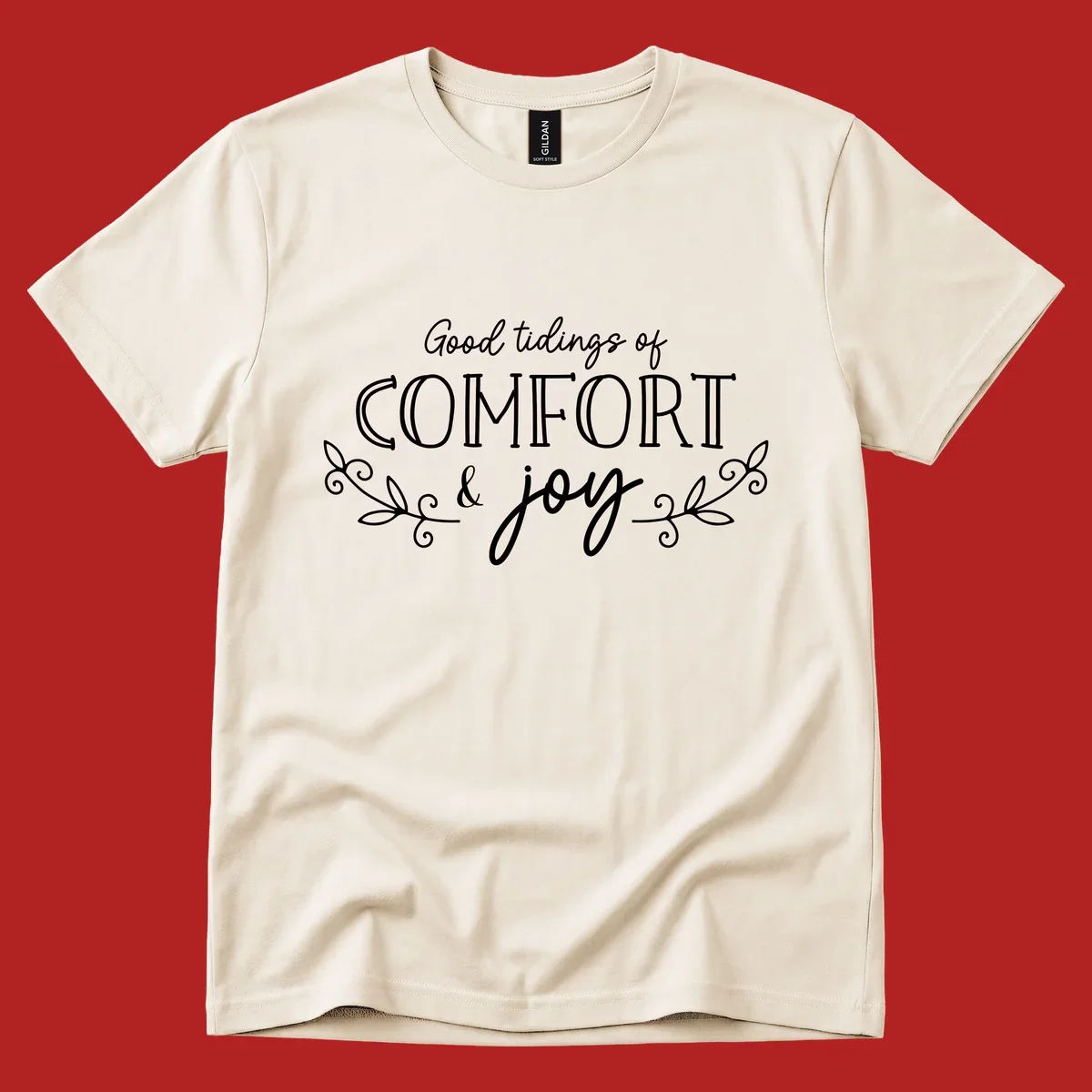 Good tidings of comfort and joy holiday text design with floral accents.