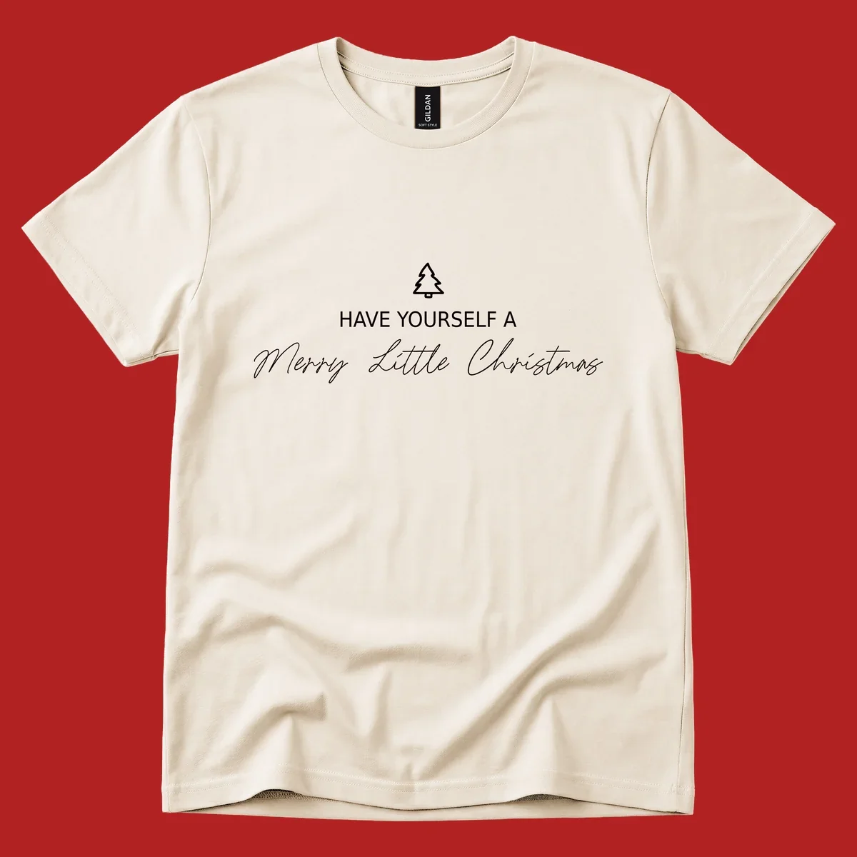 Typography design with a Christmas tree and the phrase 'Have Yourself A Merry Little Christmas' in script and block letters.