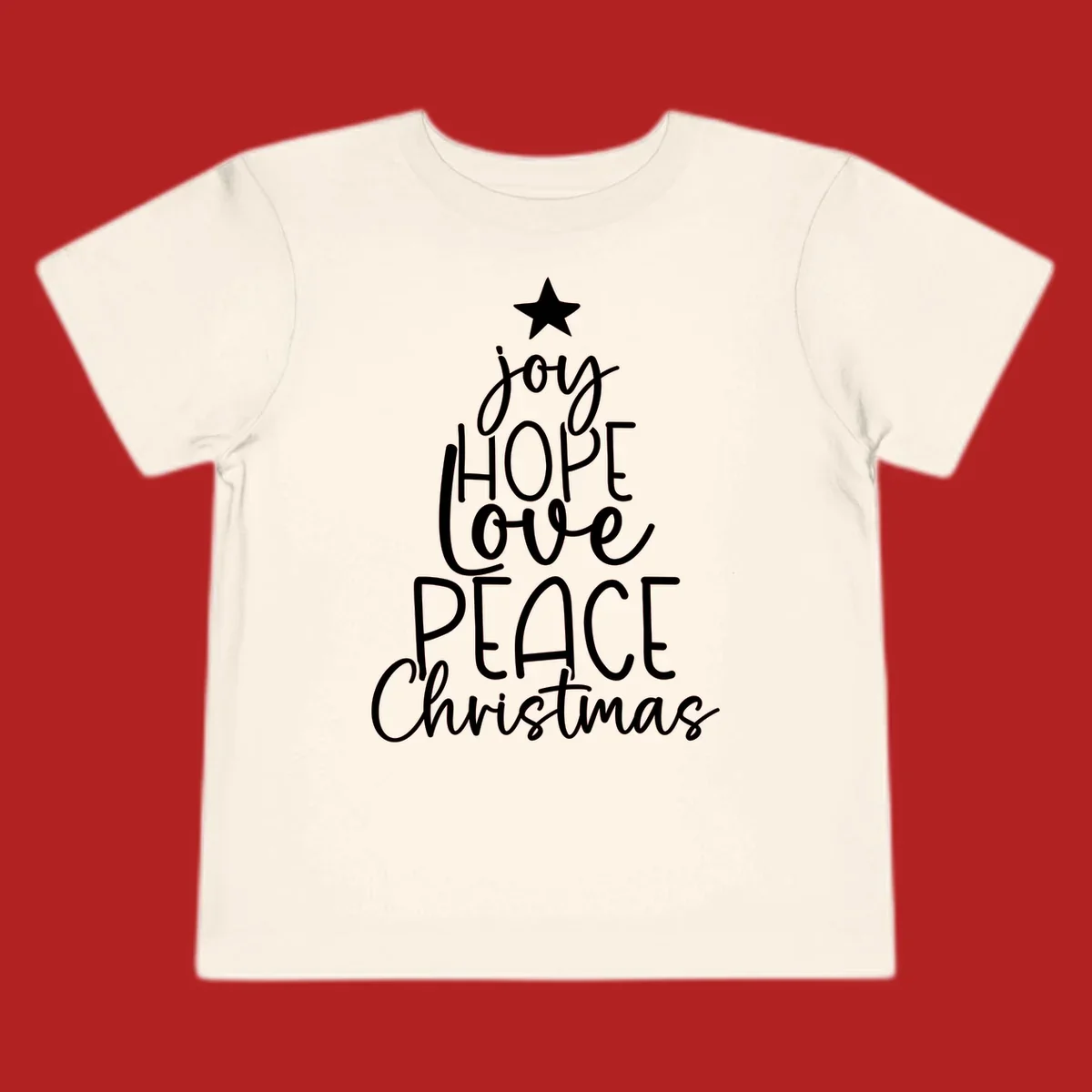 Christmas tree made of words joy, hope, love, peace, and Christmas with a star on top.
