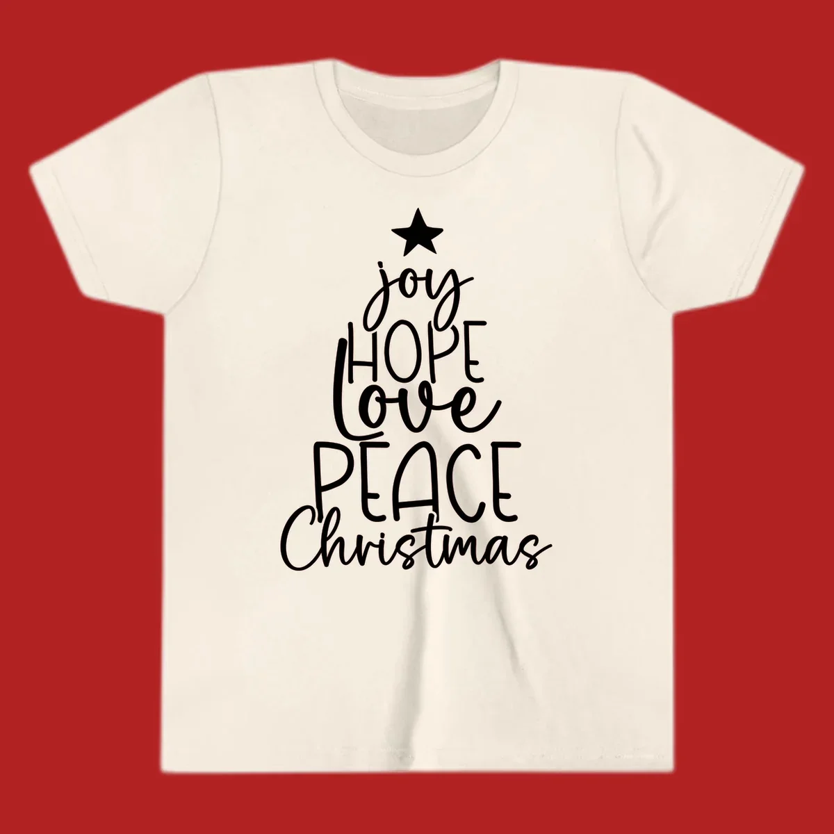 Christmas tree made of words joy, hope, love, peace, and Christmas with a star on top.