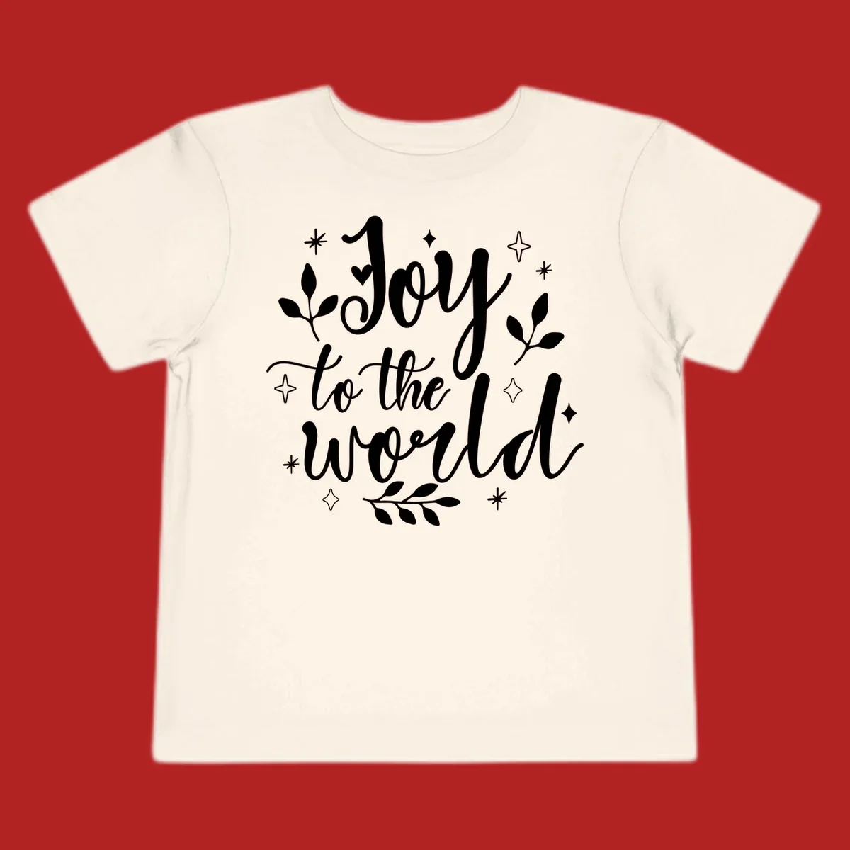 Joy to the world Christmas lettering with stars and leaves.