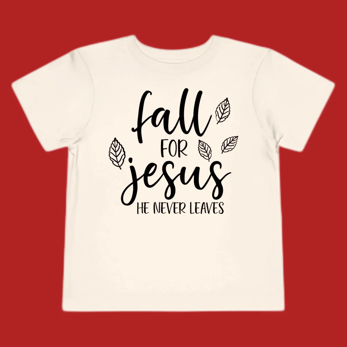Fall for Jesus He Never Leaves text with autumn leaves design