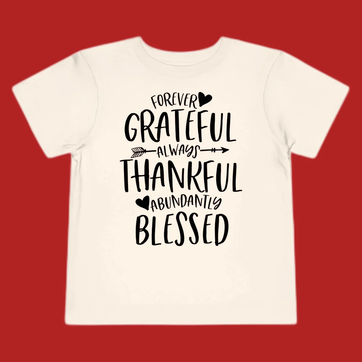 Grateful thankful blessed lettering with heart and arrow graphic