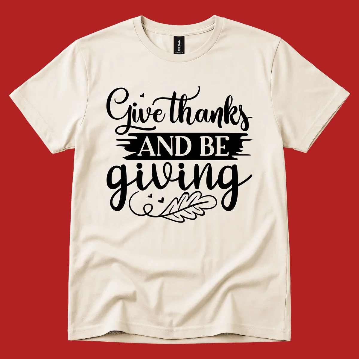 Give thanks and be giving Thanksgiving text with leaf illustration.