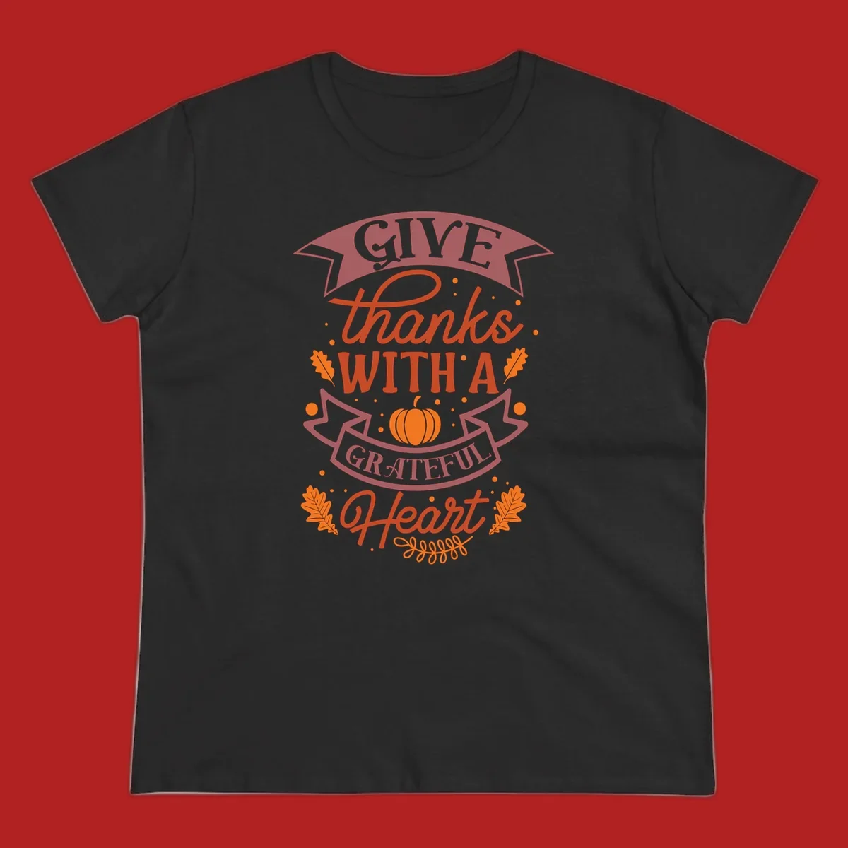 Grateful Heart Thanksgiving design with text, pumpkin, and leaves.