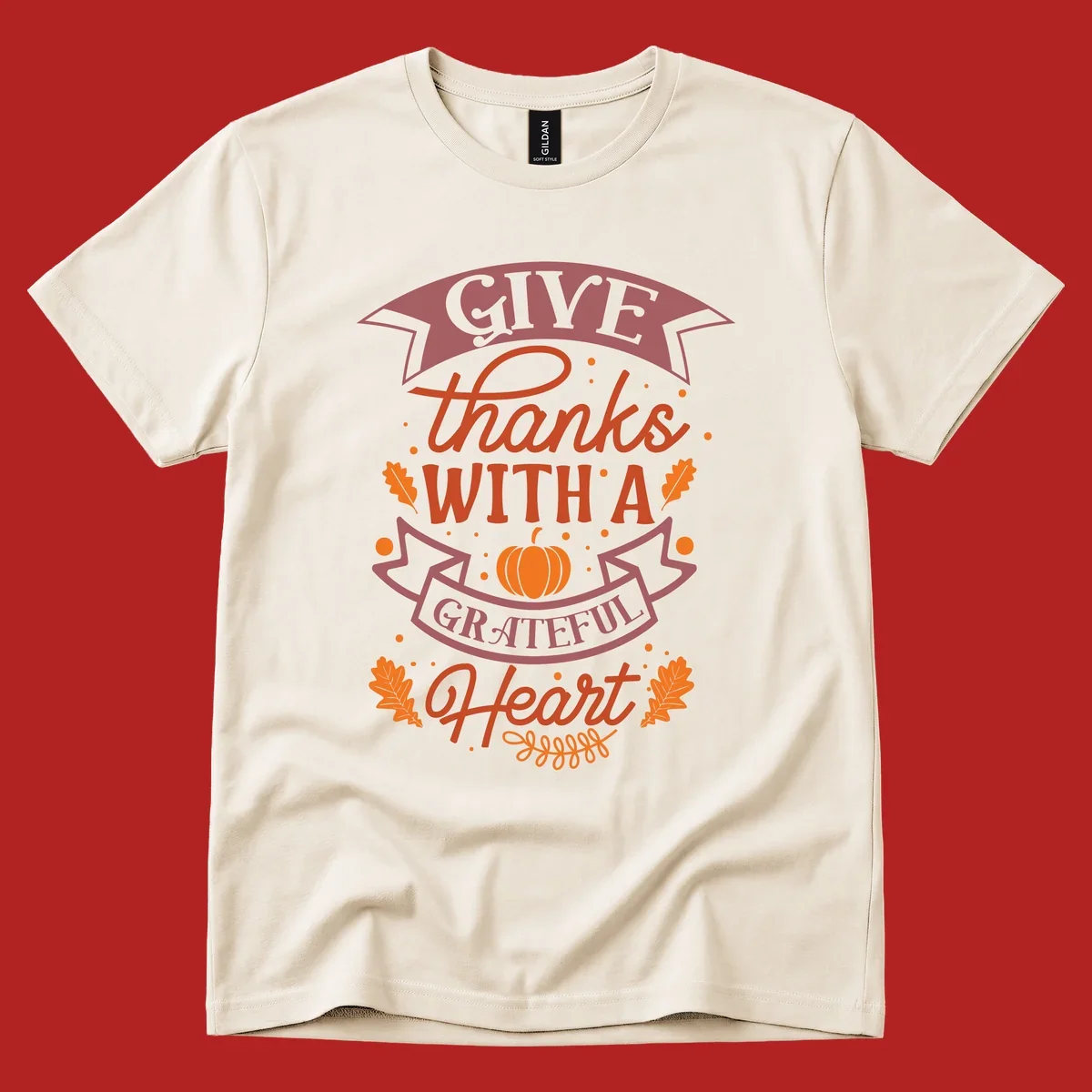 Grateful Heart Thanksgiving design with text, pumpkin, and leaves.