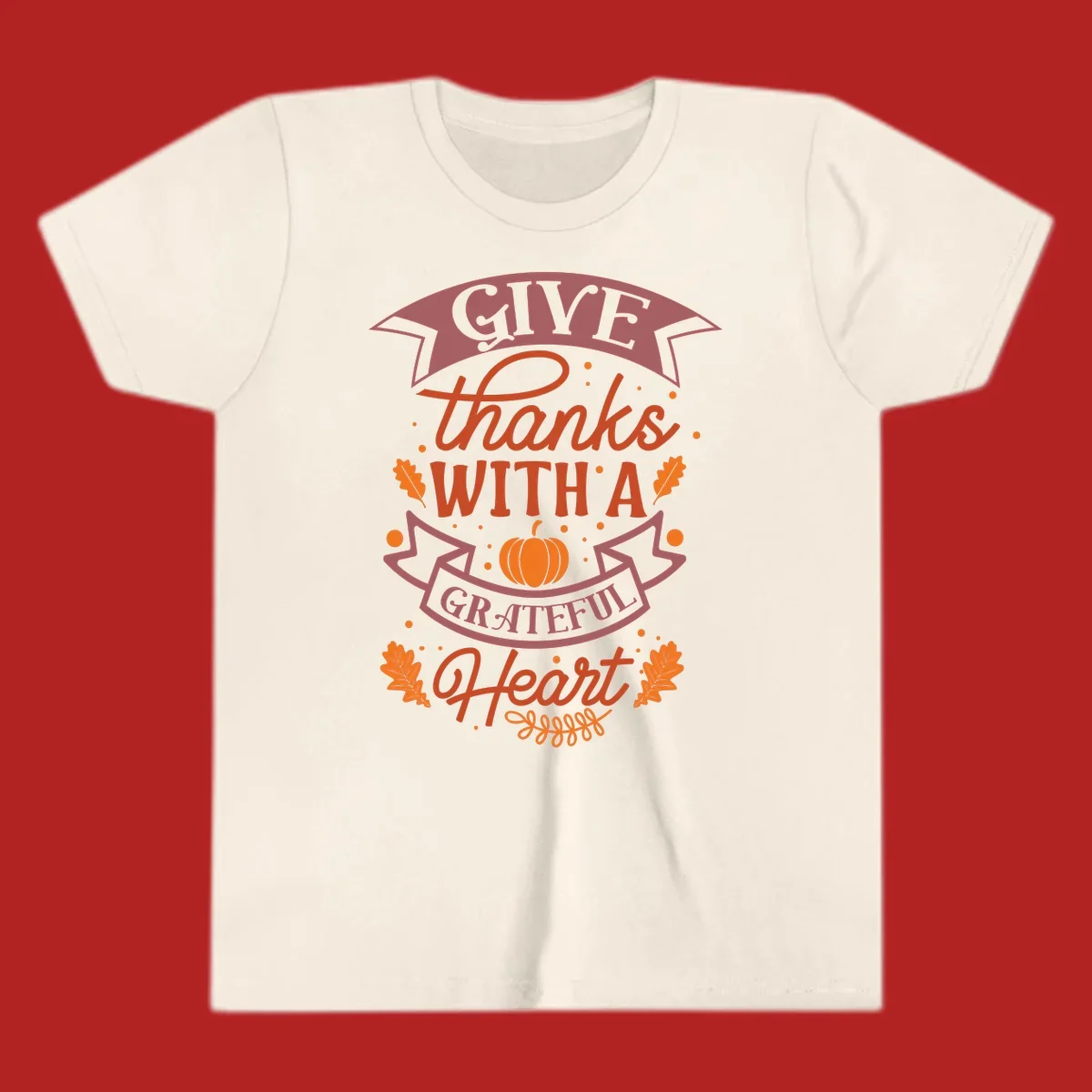 Grateful Heart Thanksgiving design with text, pumpkin, and leaves.