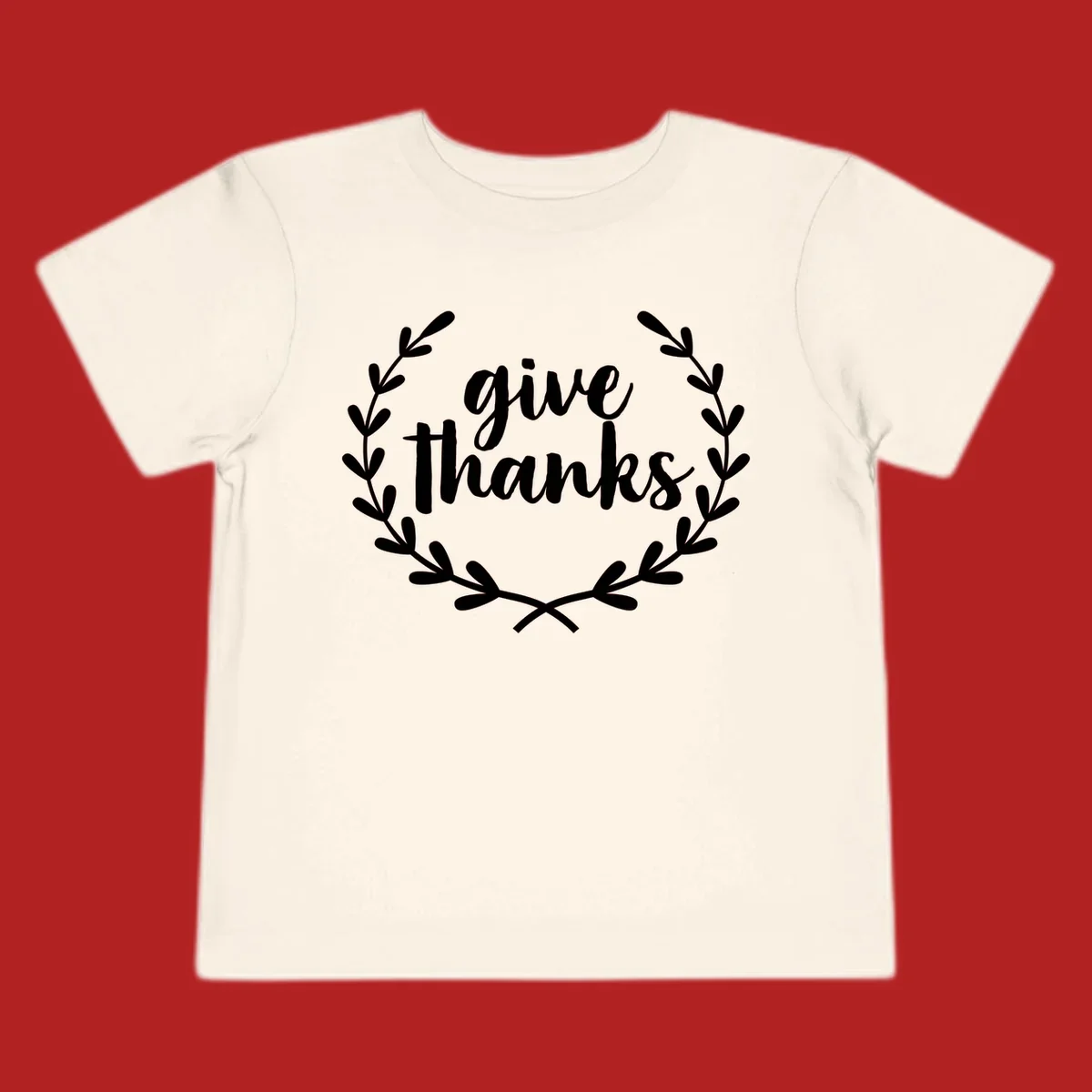 Give thanks script text inside a laurel wreath.