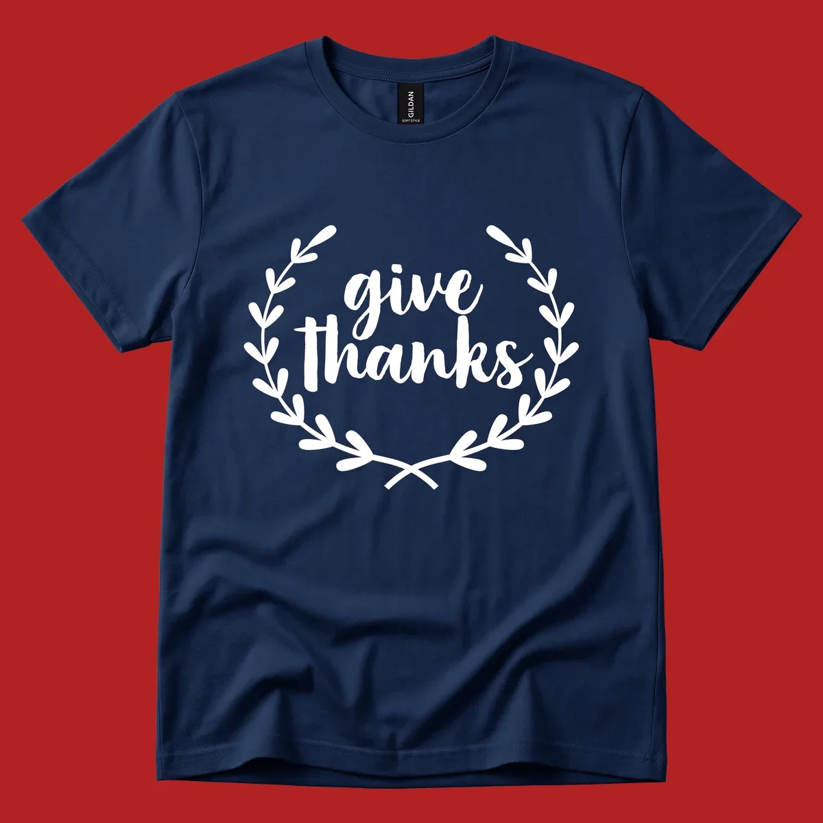 Give thanks script text inside a laurel wreath.