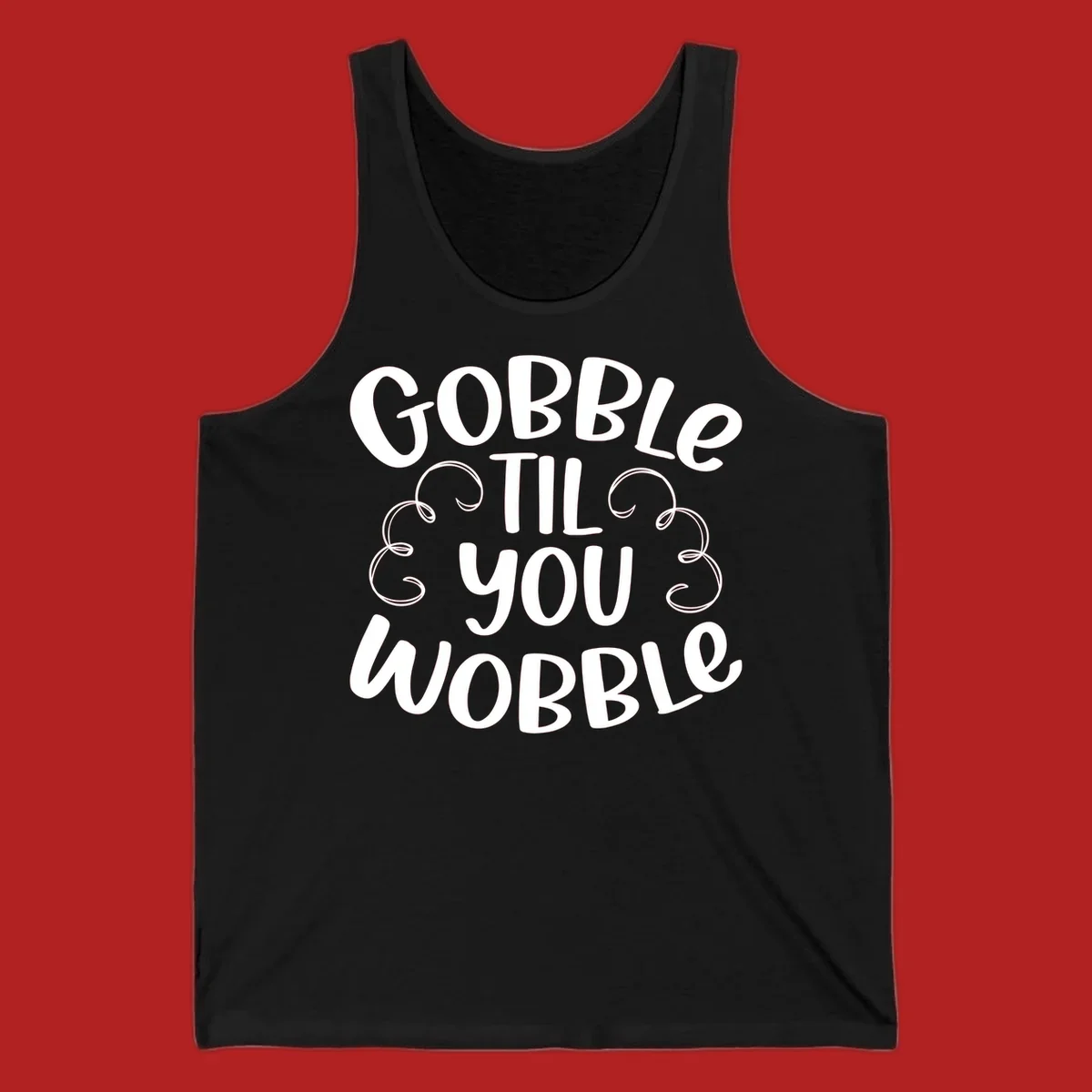 Gobble Til You Wobble Thanksgiving phrase in white text with decorative swirls.