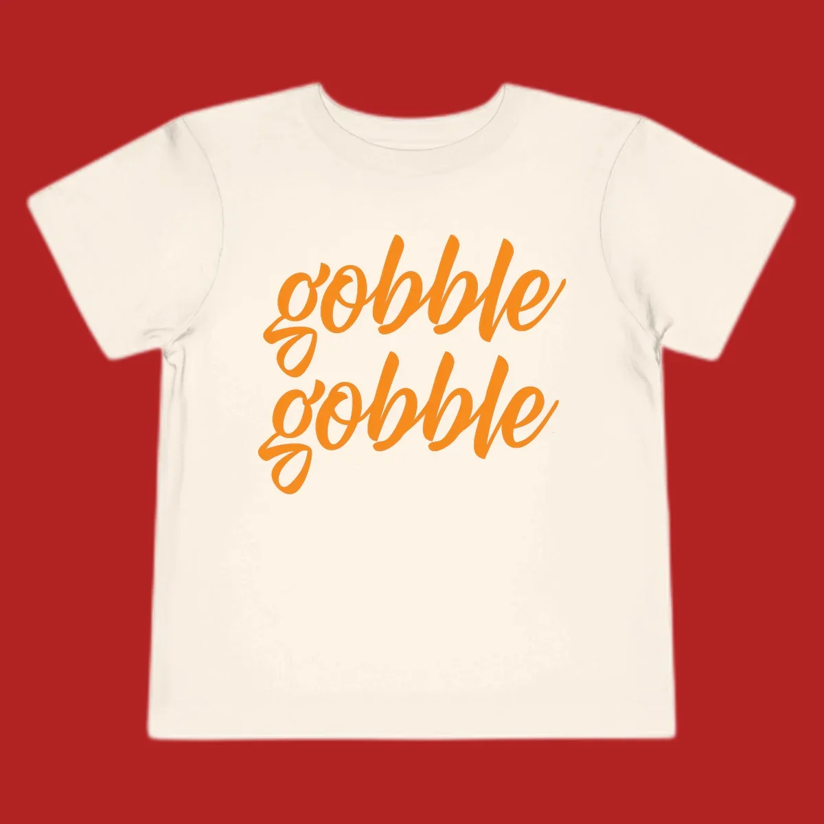 Orange script text 'gobble gobble' repeated twice. Thanksgiving phrase.