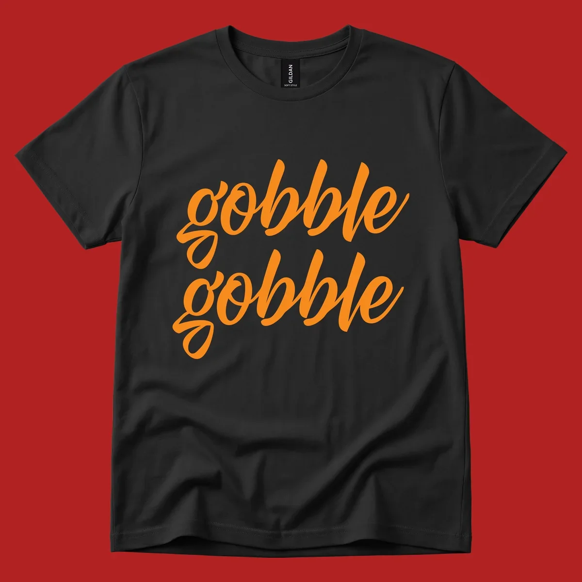 Orange script text 'gobble gobble' repeated twice. Thanksgiving phrase.