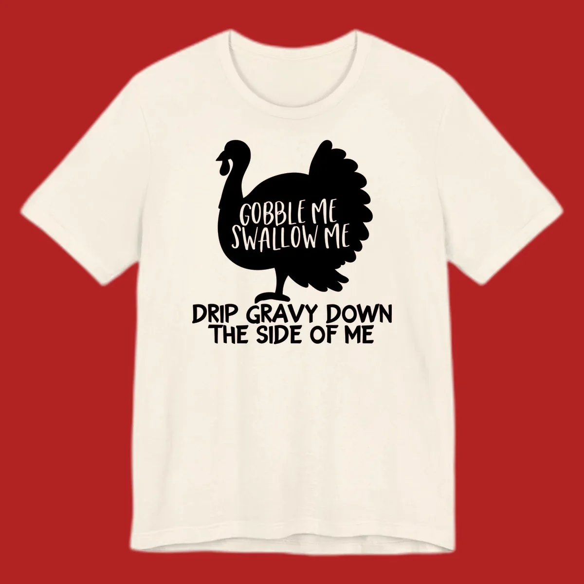 Thanksgiving turkey design with text, featuring a silhouette and the phrase 'Gobble Me Swallow Me Drip Gravy Down The Side Of Me'.