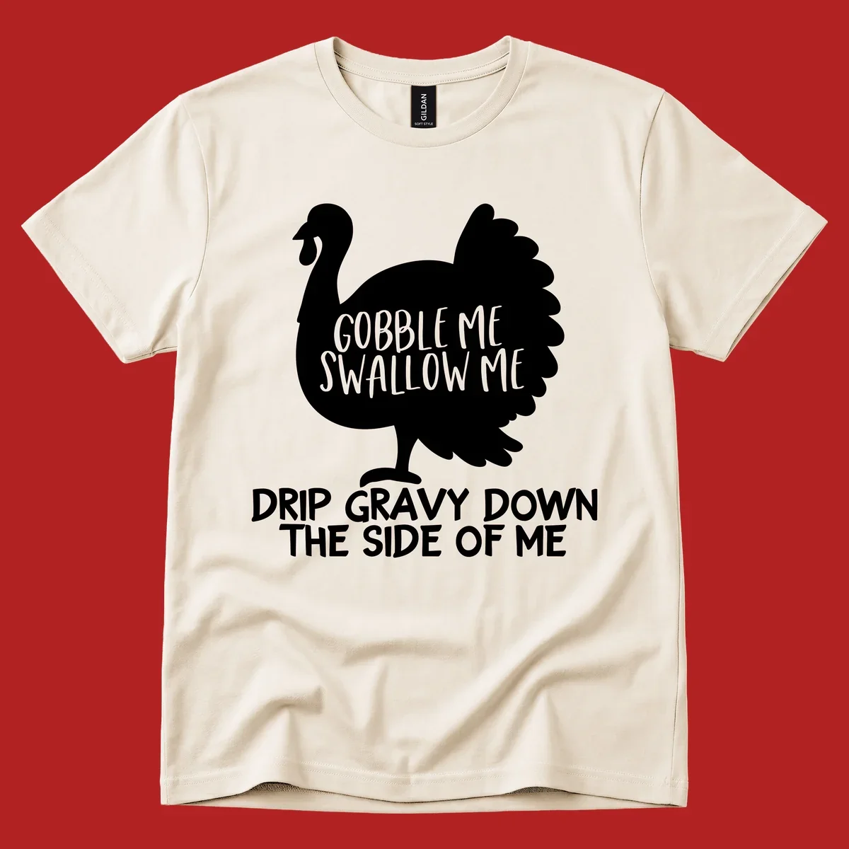 Thanksgiving turkey design with text, featuring a silhouette and the phrase 'Gobble Me Swallow Me Drip Gravy Down The Side Of Me'.