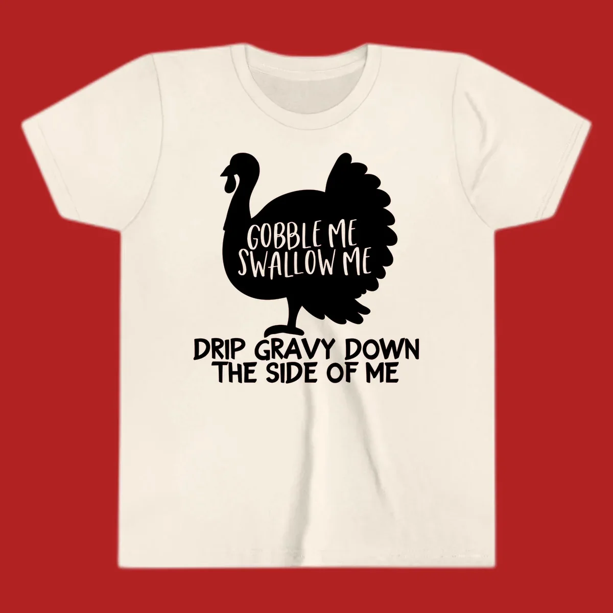 Thanksgiving turkey design with text, featuring a silhouette and the phrase 'Gobble Me Swallow Me Drip Gravy Down The Side Of Me'.
