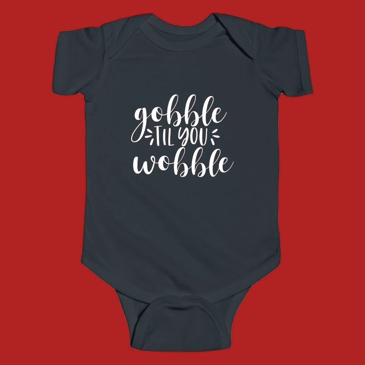 Gobble 'til you wobble thanksgiving phrase in white script font.
