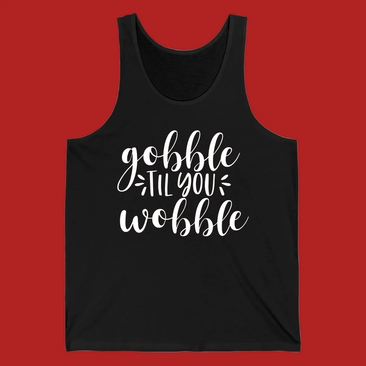 Gobble 'til you wobble thanksgiving phrase in white script font.