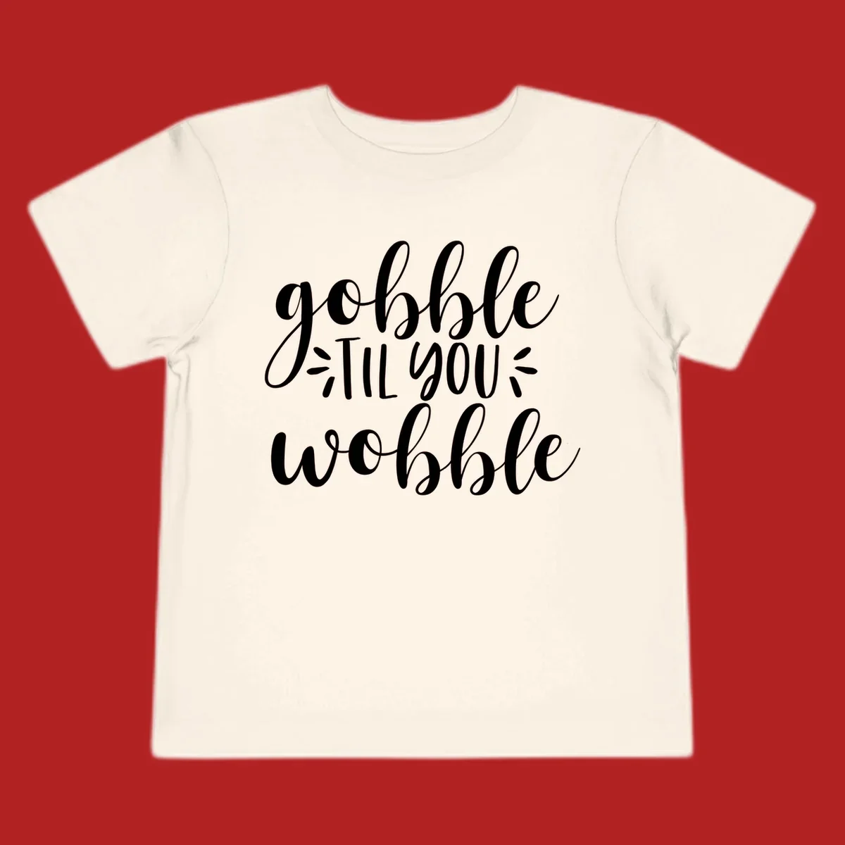 Gobble 'til you wobble thanksgiving phrase in white script font.