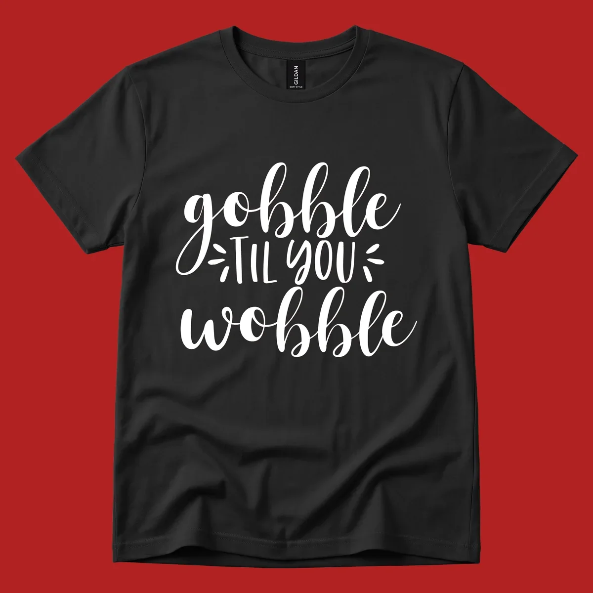 Gobble 'til you wobble thanksgiving phrase in white script font.